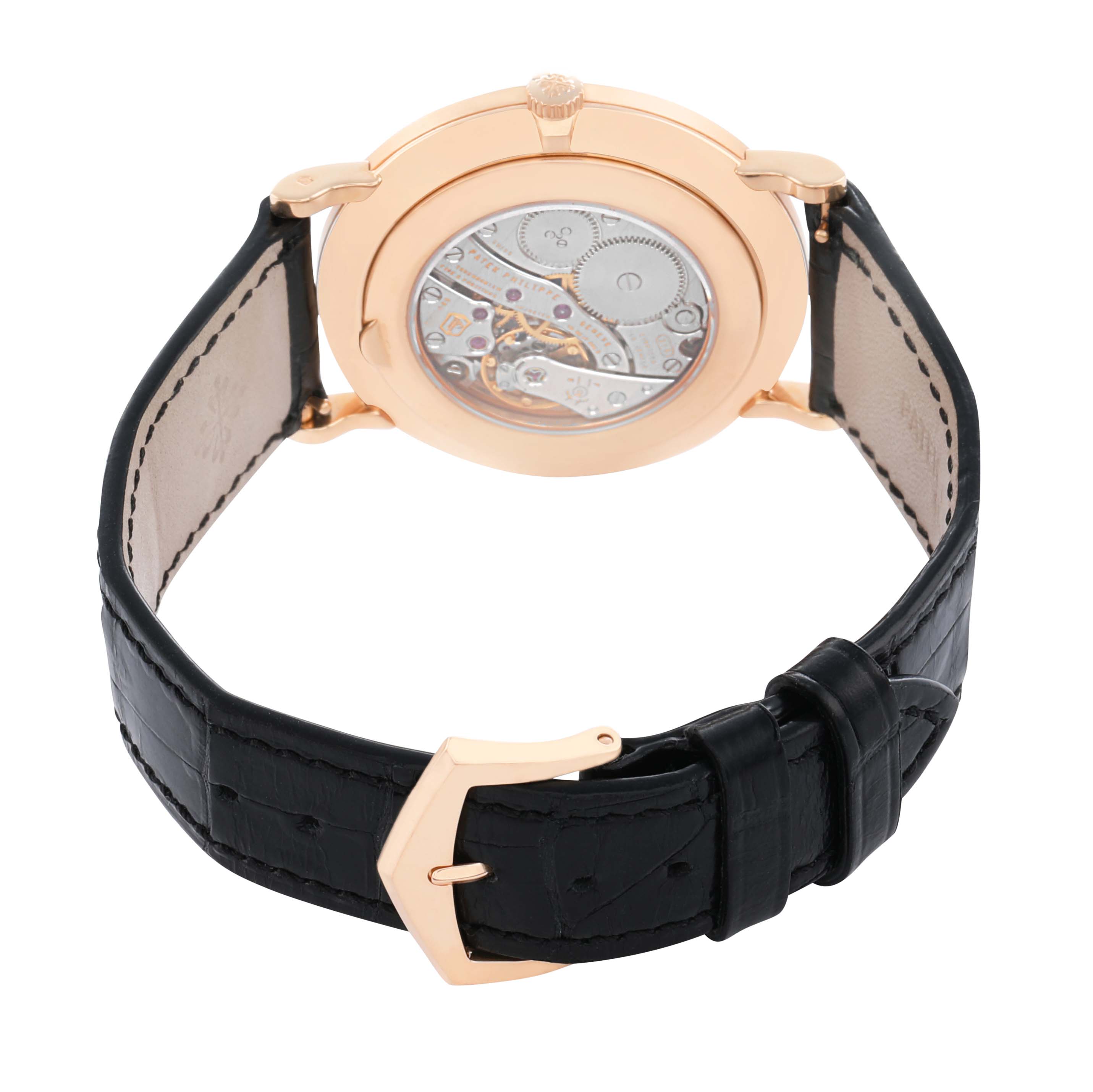 The photo shows the back view of a Patek Philippe Calatrava 5119R Men's Rose Gold White Dial watch, highlighting its movement and black leather strap.