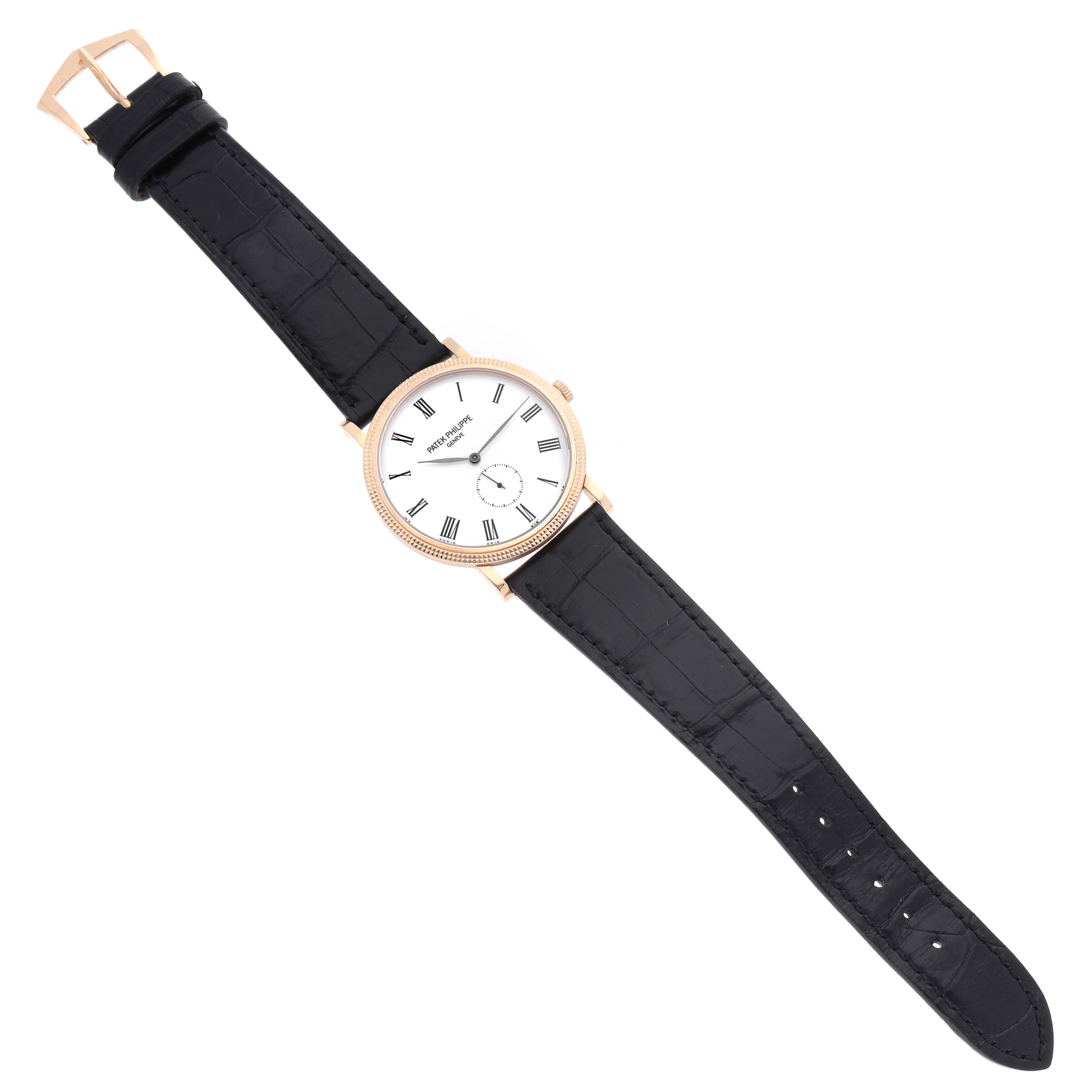 The Patek Philippe Calatrava 5119R Men's Rose Gold White Dial watch is shown at a top view angle, displaying its face, case, and leather strap.