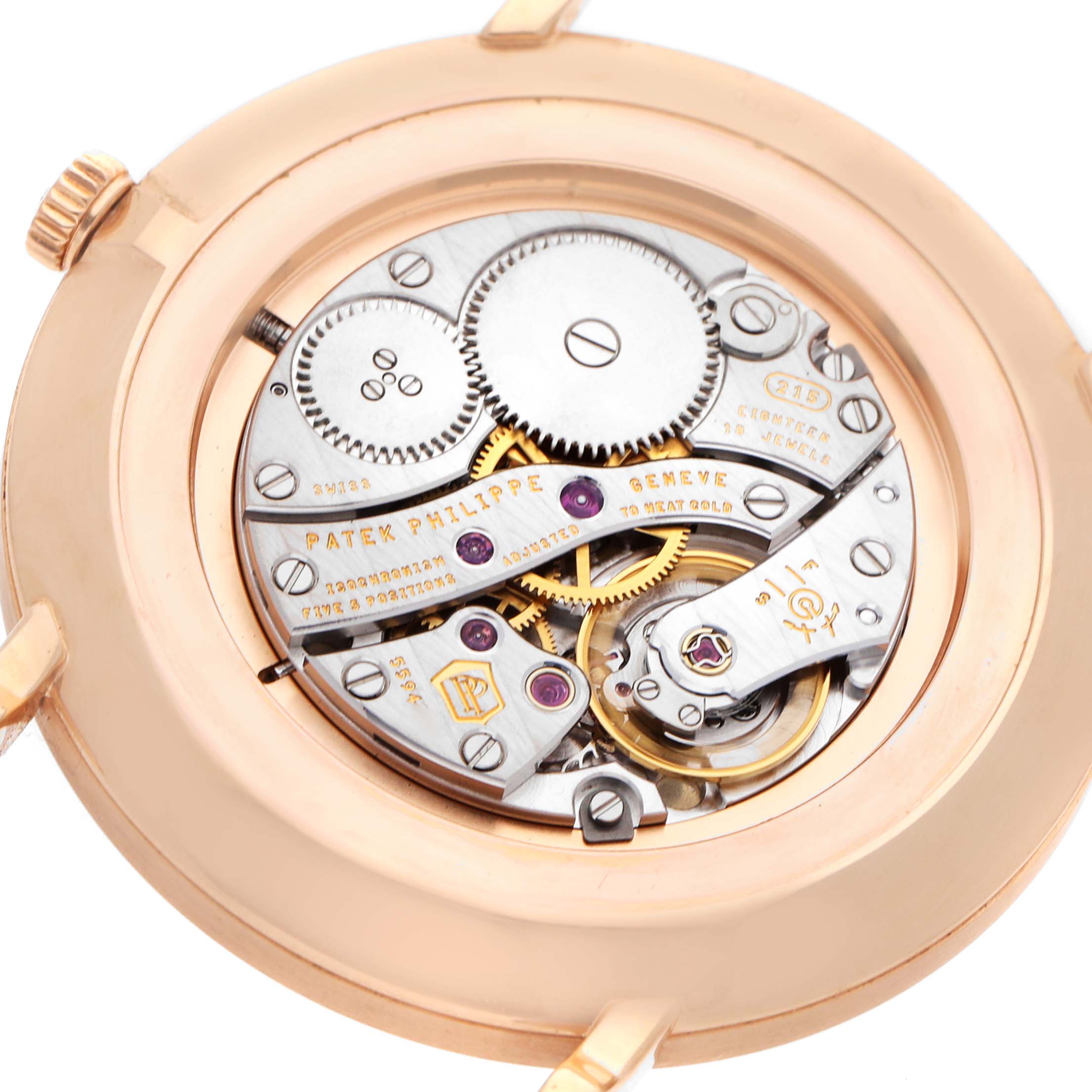 The image shows the Patek Philippe Calatrava 5119R Men's Rose Gold White Dial watch from the back, highlighting its intricate mechanical movement.