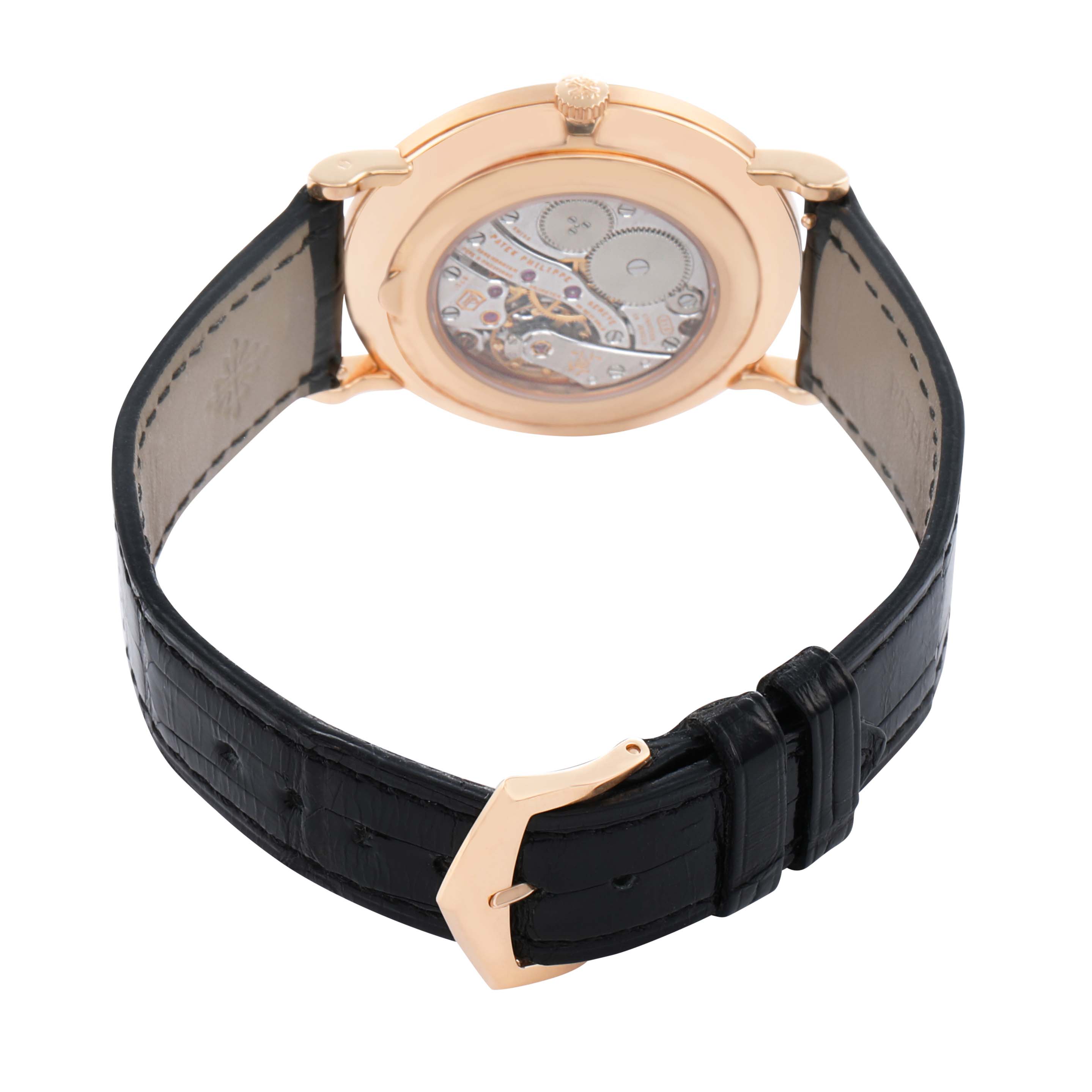 The image shows the back of a Patek Philippe Calatrava 5119R Men's Rose Gold White Dial watch, highlighting its movement and black leather strap.