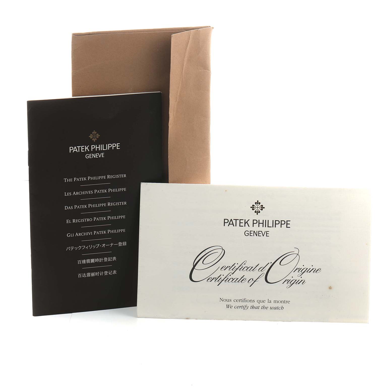 The image shows Patek Philippe Calatrava 5119R Men's Rose Gold White Dial watch documents including a certificate and a register booklet.