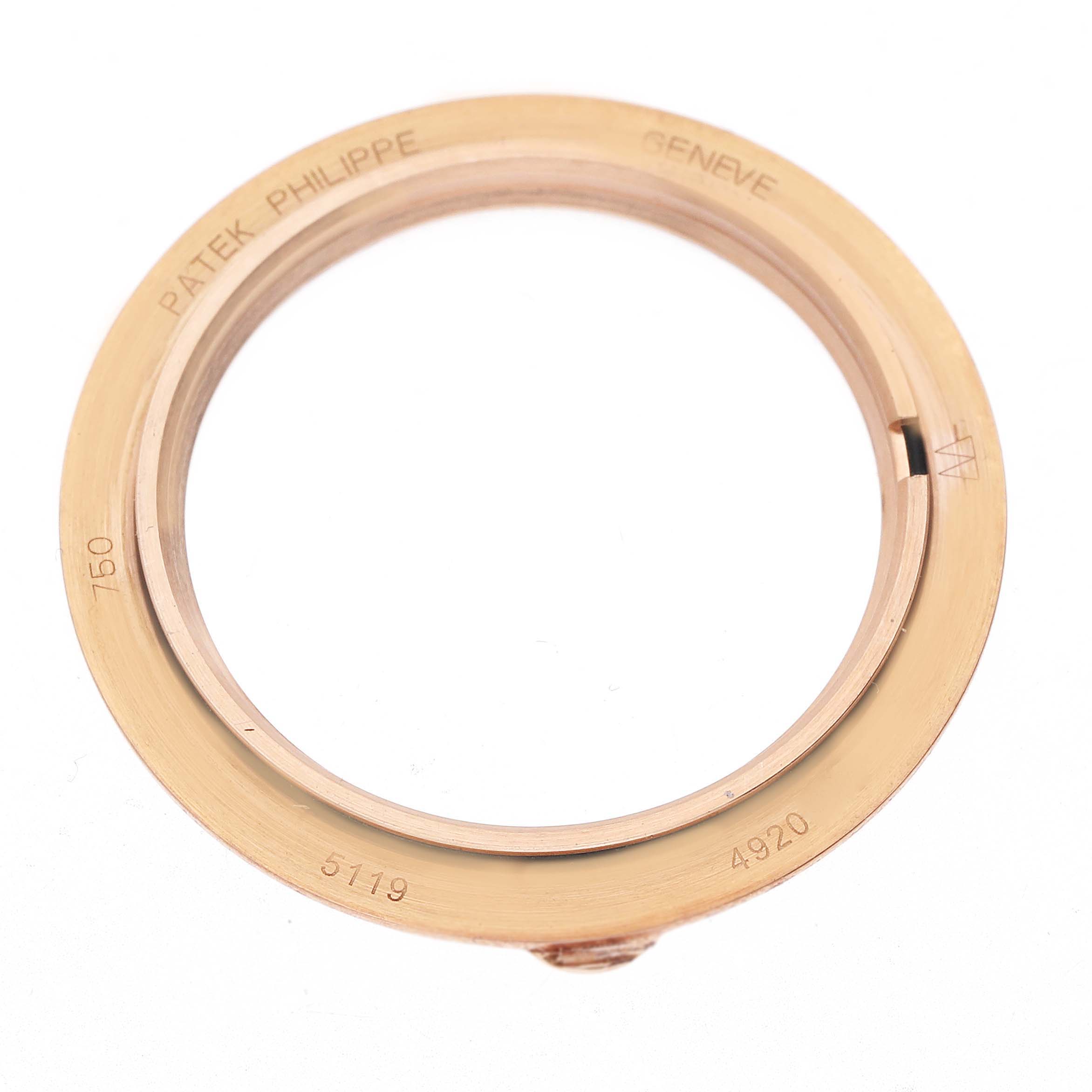 The image shows a gold watch bezel for a Patek Philippe Calatrava 5119R Men's Rose Gold White Dial, prominently engraved with model information.