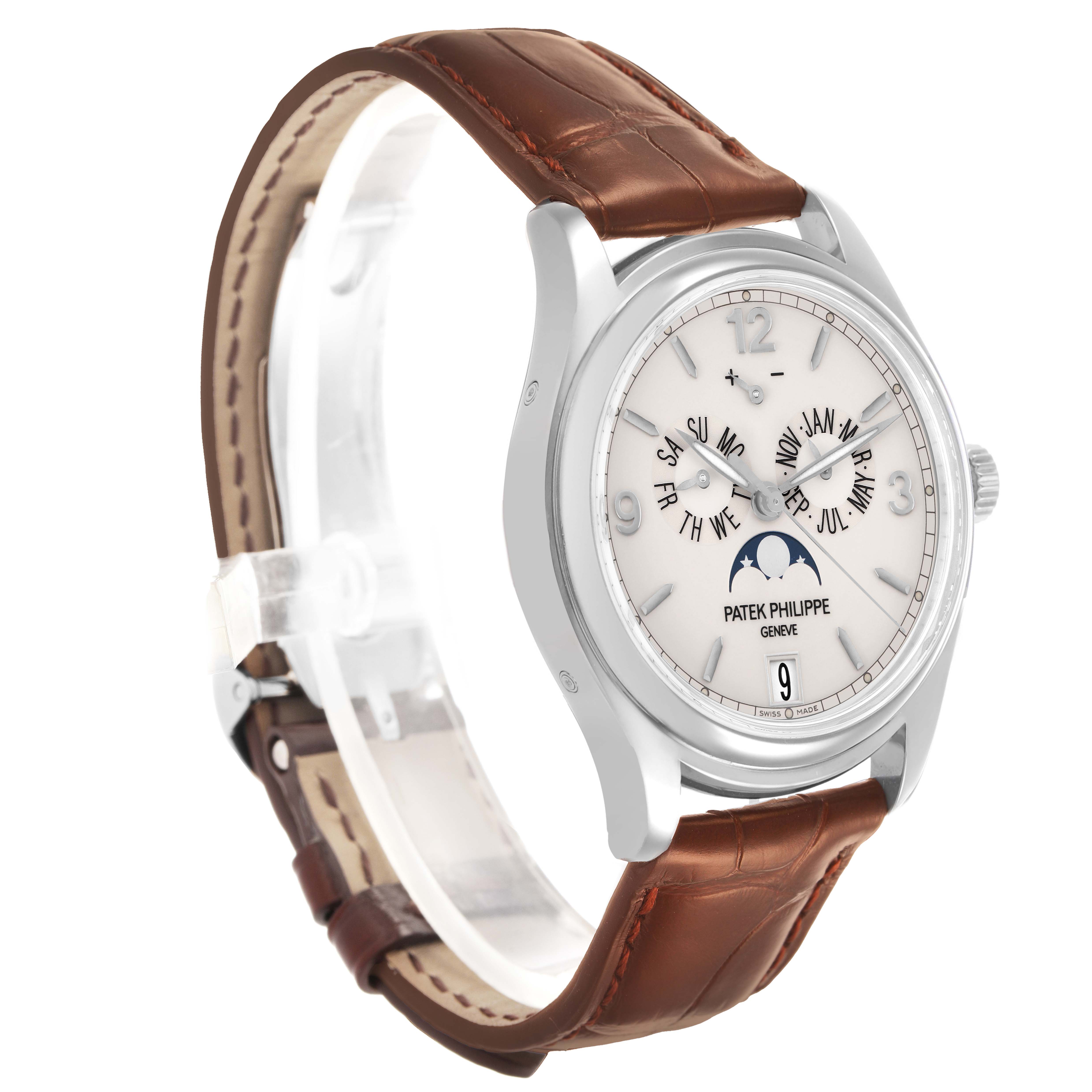 The Patek Philippe Complications 5146G-001 Men's White Gold White Dial watch is shown at a three-quarter angle, highlighting the face, crown, and brown leather strap.