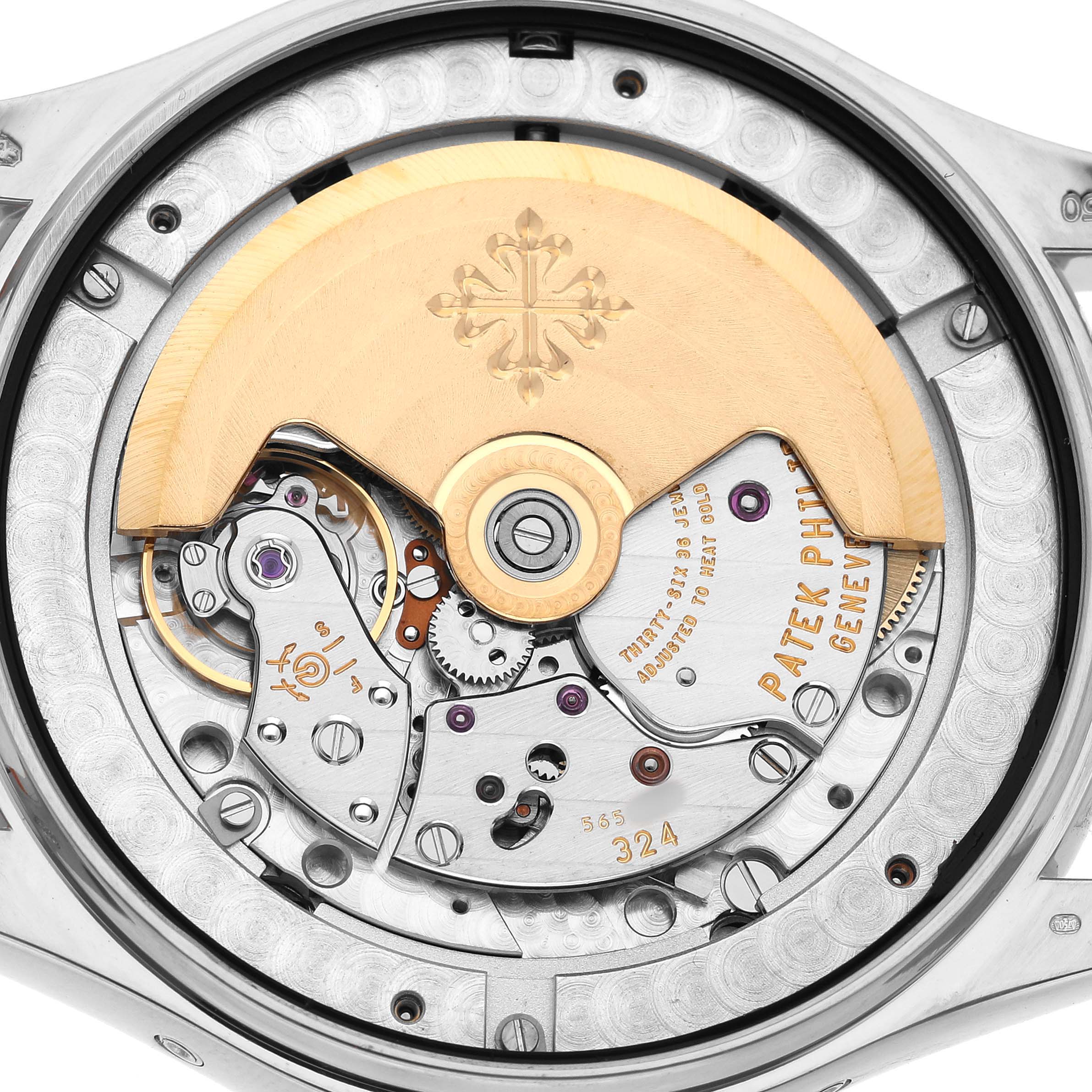 The image shows the back view of a Patek Philippe Complications 5146G-001 Men's White Gold White Dial model, highlighting its intricate mechanical movement.
