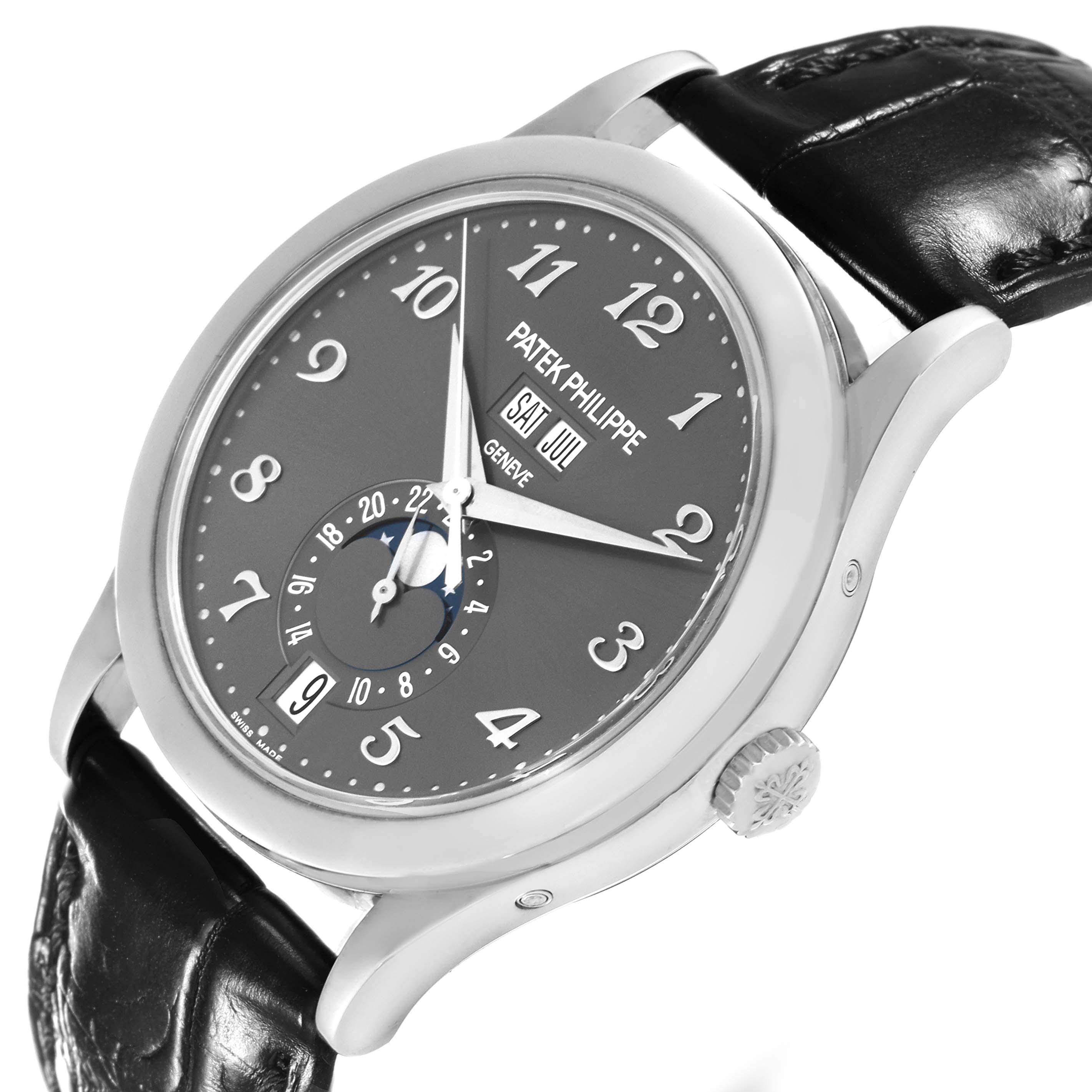 The Patek Philippe Complications 5396G-014 Men
s White Gold Silver Dial 5396G-014 Men
s White Gold Silver Dial watch is shown from a slight angle, displaying the face, crown, and black leather strap.