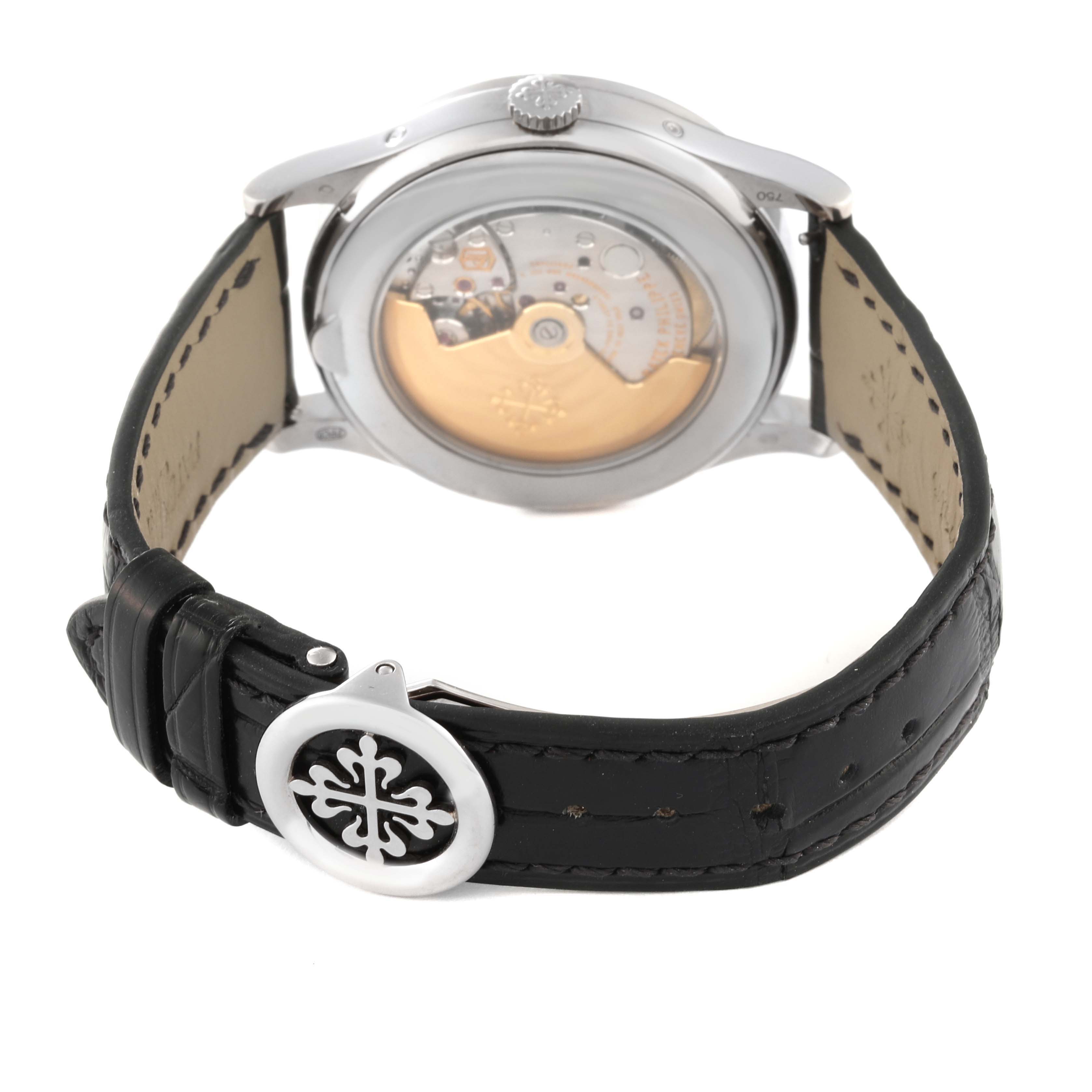 The image shows a rear view of the Patek Philippe Complications 5396G-014 Men
s White Gold Silver Dial 5396G-014 Men
s White Gold Silver Dial model, highlighting its movement and leather strap with a decorative clasp.