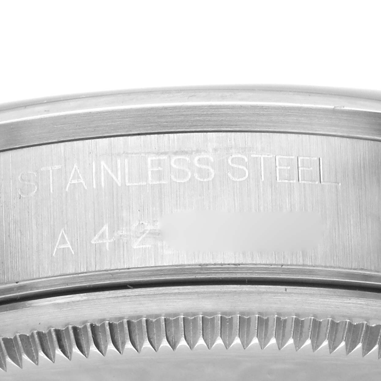 The image shows a close-up of the case back of a Rolex Air-King 14000 Men's Stainless Steel Black Dial 14000 Men's Stainless Steel Black Dial watch, highlighting the "STAINLESS STEEL" engraving.