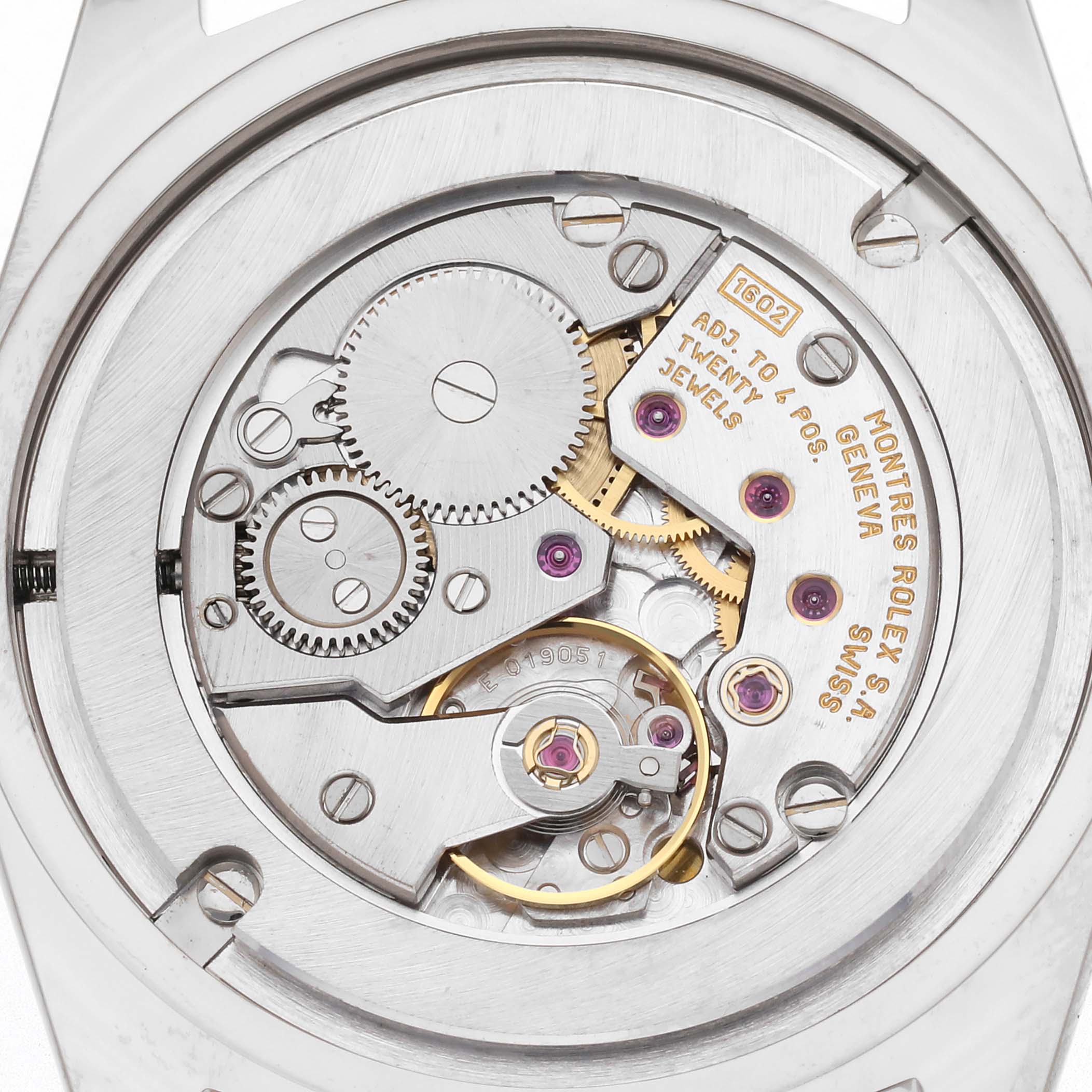 The image shows the movement of a Rolex Cellini 4233 Men's White Gold White Dial watch from a top-down angle, highlighting gears and jewels.