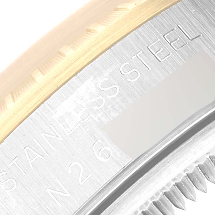 This close-up image shows the side engraving of the Rolex Date 15223 Men's Steel and Gold (two tone) Champagne Dial 15223 Men's Steel and Gold (two tone) Champagne Dial model watch, highlighting the stainless steel and gold bezel.