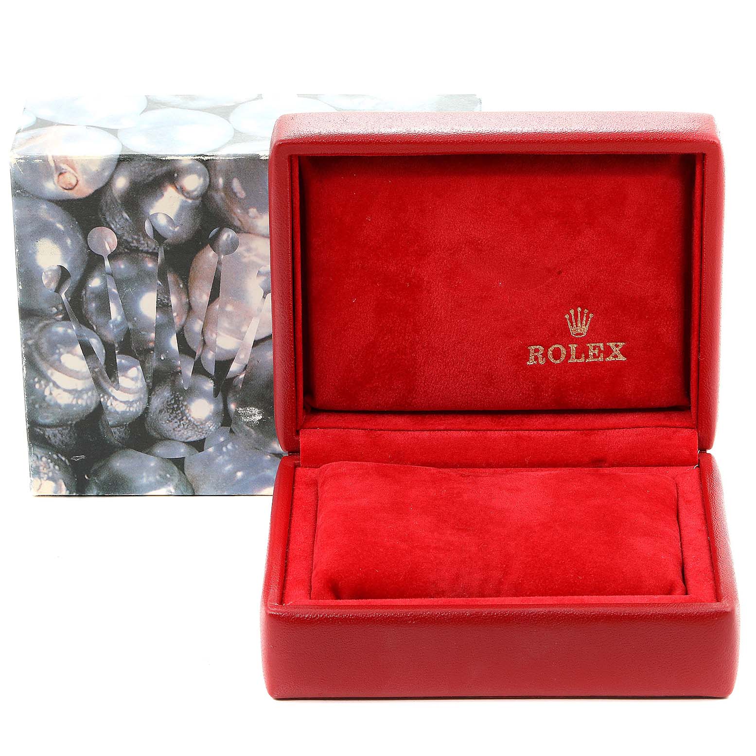 The image shows an open red Rolex watch box for the Datejust model, with a decorative outer box behind it.