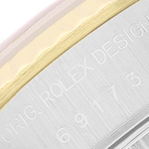 This image shows a close-up view of the side engraving on a Rolex Datejust 69173 Women's Steel and Gold (two tone) Blue Dial 69173 Women's Steel and Gold (two tone) Blue Dial watch, featuring the model information.