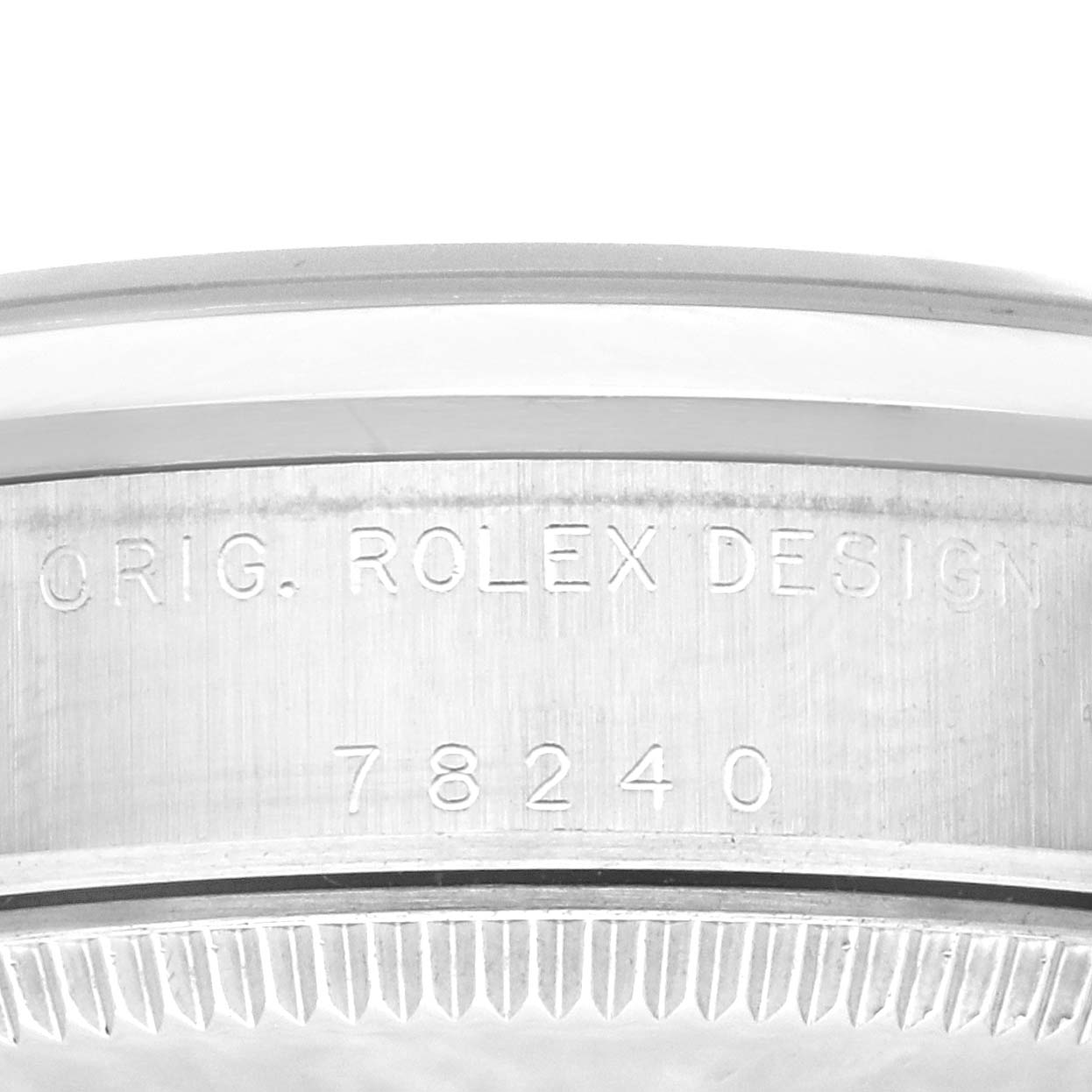 This image shows a close-up of the case side of a Rolex Mid-Size 78240 Women's Stainless Steel Pink Dial 78240 Women's Stainless Steel Pink Dial model, with the engraving "ORIG. ROLEX DESIGN 78240."