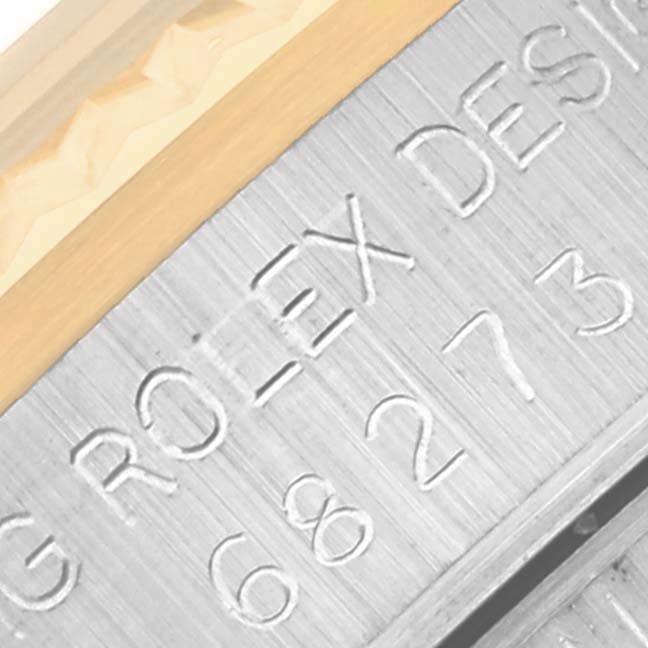 This image shows a close-up of the side of a Mid-Size Rolex watch, highlighting the engraved text "ROLEX DESIGN."