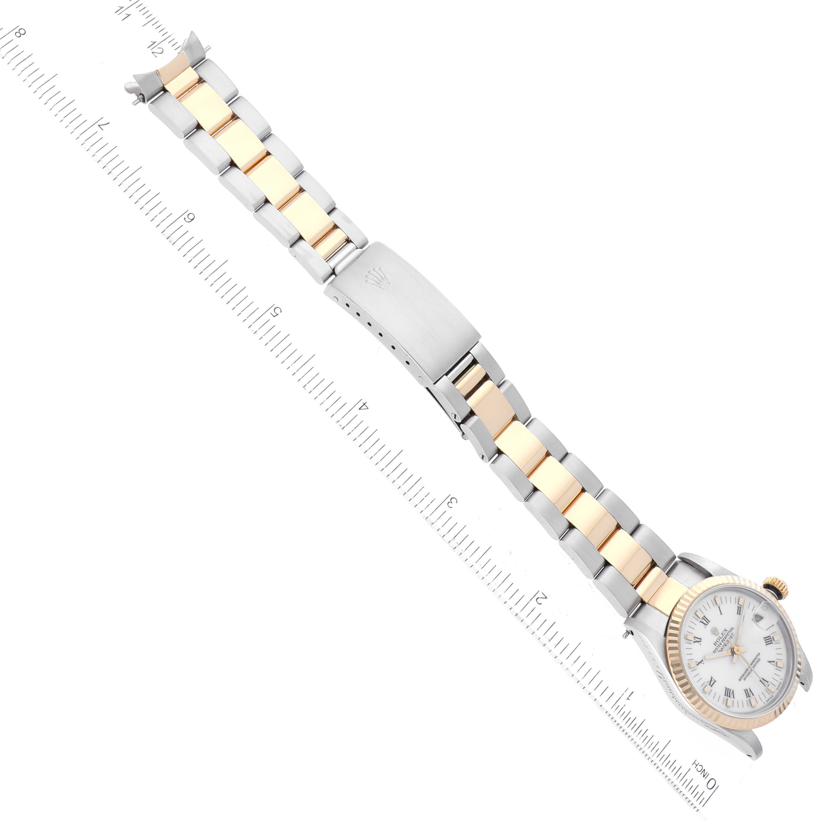 The image shows a top view of a Rolex Mid-Size 68273 Women's Steel and Gold (two tone) White Dial 68273 Women's Steel and Gold (two tone) White Dial watch, focusing on its two-tone bracelet and clasp.