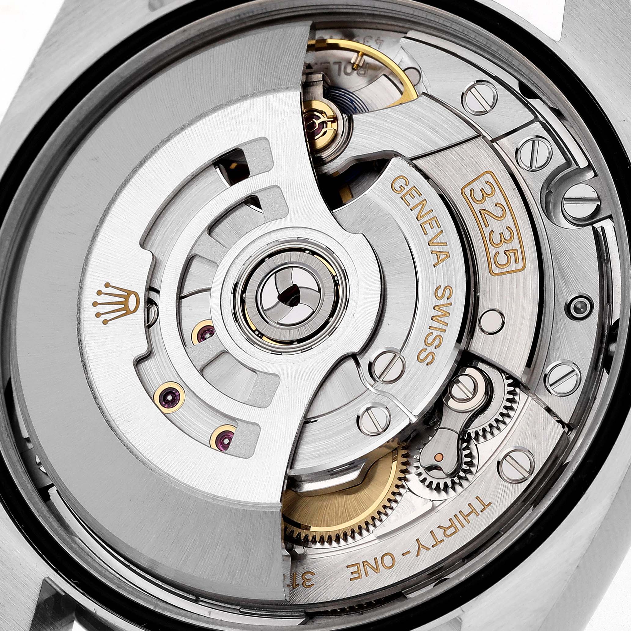 This image shows a close-up of the Rolex Datejust 126200 Men's Stainless Steel Silver Dial 126200 Men's Stainless Steel Silver Dial's 3235 movement mechanism from the back, highlighting its intricate inner workings.