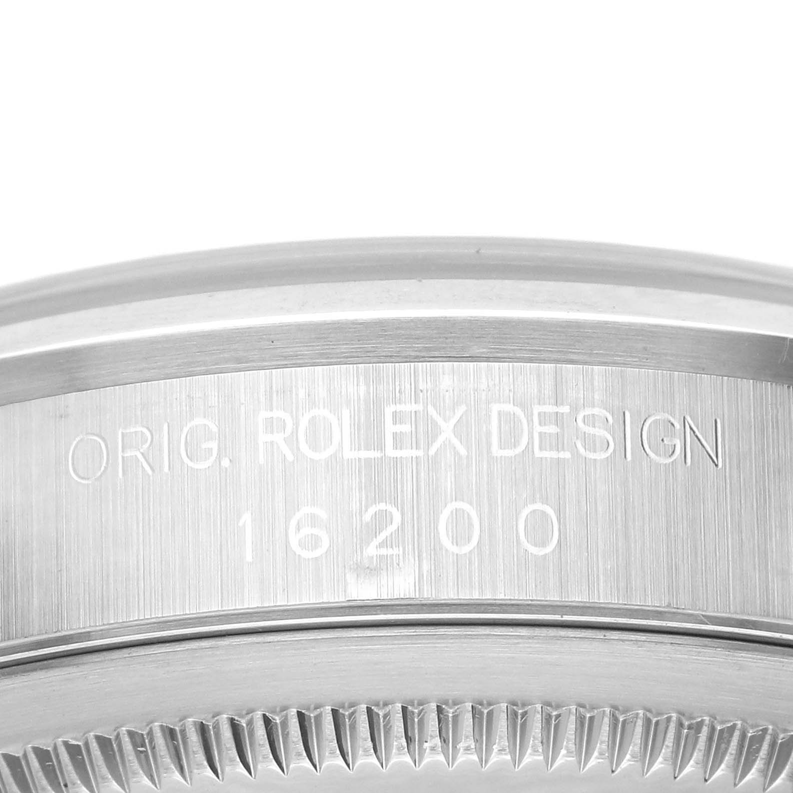 This close-up shows the engraved model number "16200" and "Orig. Rolex Design" on the side of a Rolex Datejust 16200 Men
s Stainless Steel Silver Dial 16200 Men
s Stainless Steel Silver Dial case.