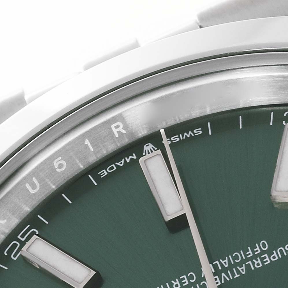 This close-up image shows a partial view of the dial and bezel of the Rolex Datejust 41 126300 Men's Stainless Steel Green Dial 126300 Men's Stainless Steel Green Dial, with focus on the text and markers.