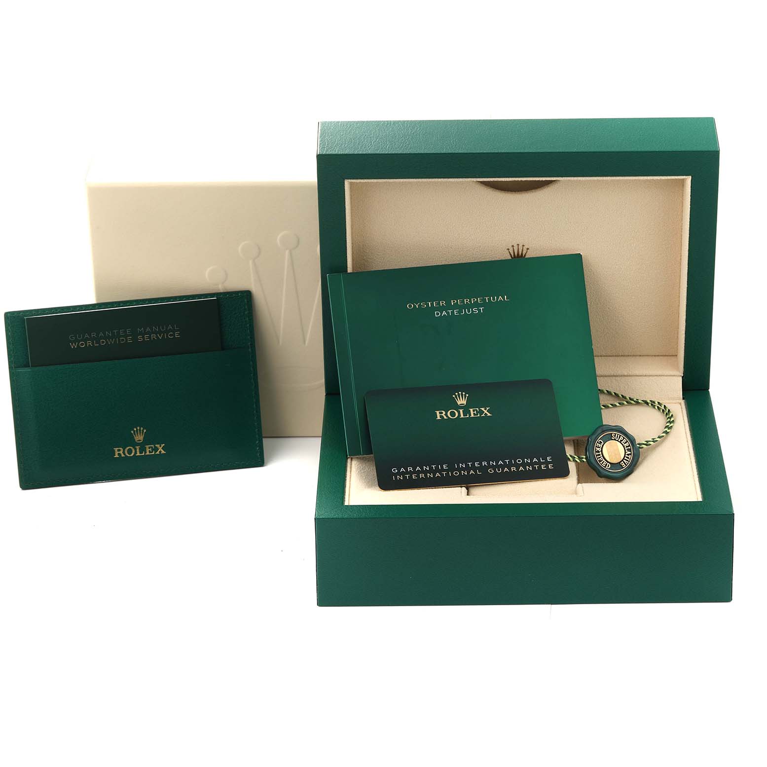 The image shows the accessories for a Rolex Datejust 41 126300 Men's Stainless Steel Green Dial 126300 Men's Stainless Steel Green Dial, including the box, warranty card, guarantee manual, and tag.
