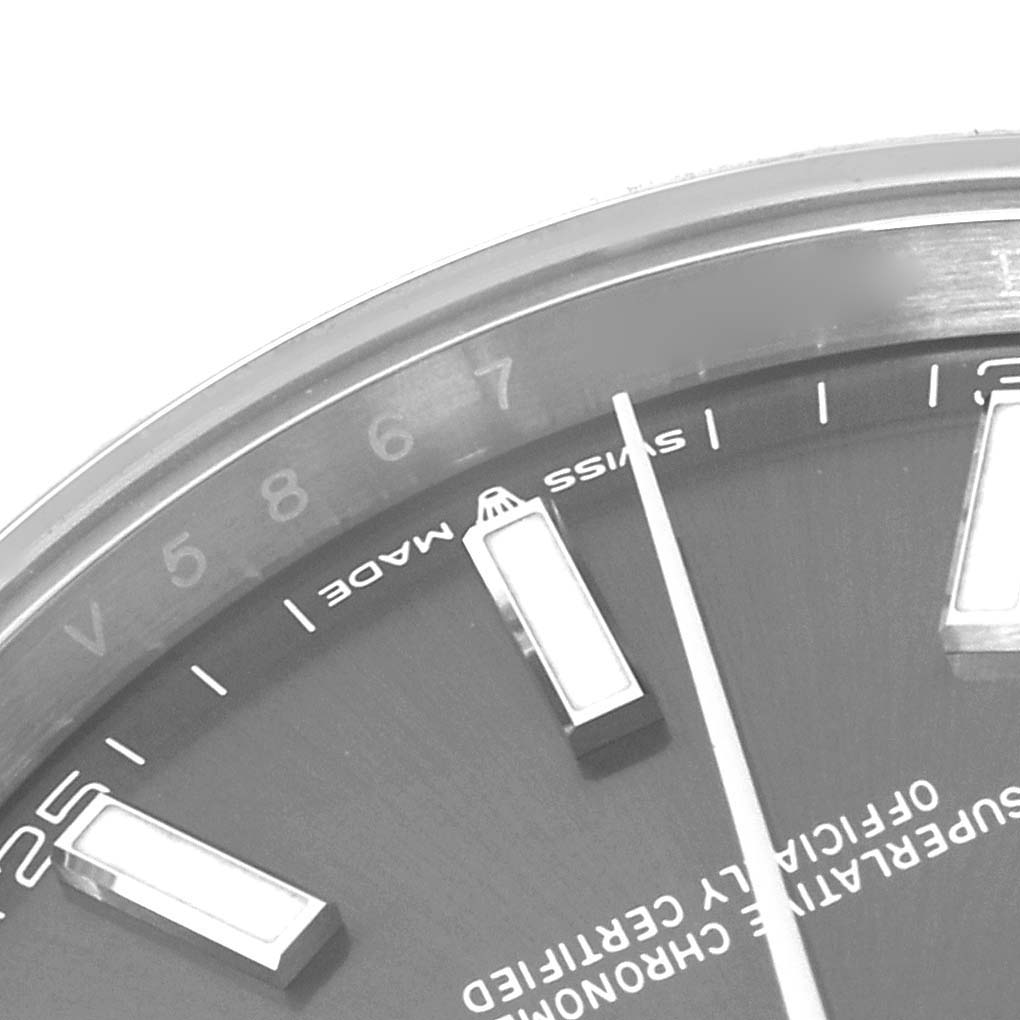 This is a close-up image of the dial and part of the bezel of the Rolex Datejust 41 126300 Men's Stainless Steel Grey Dial 126300 Men's Stainless Steel Grey Dial watch, showing the hour markers and the "Swiss Made" text.