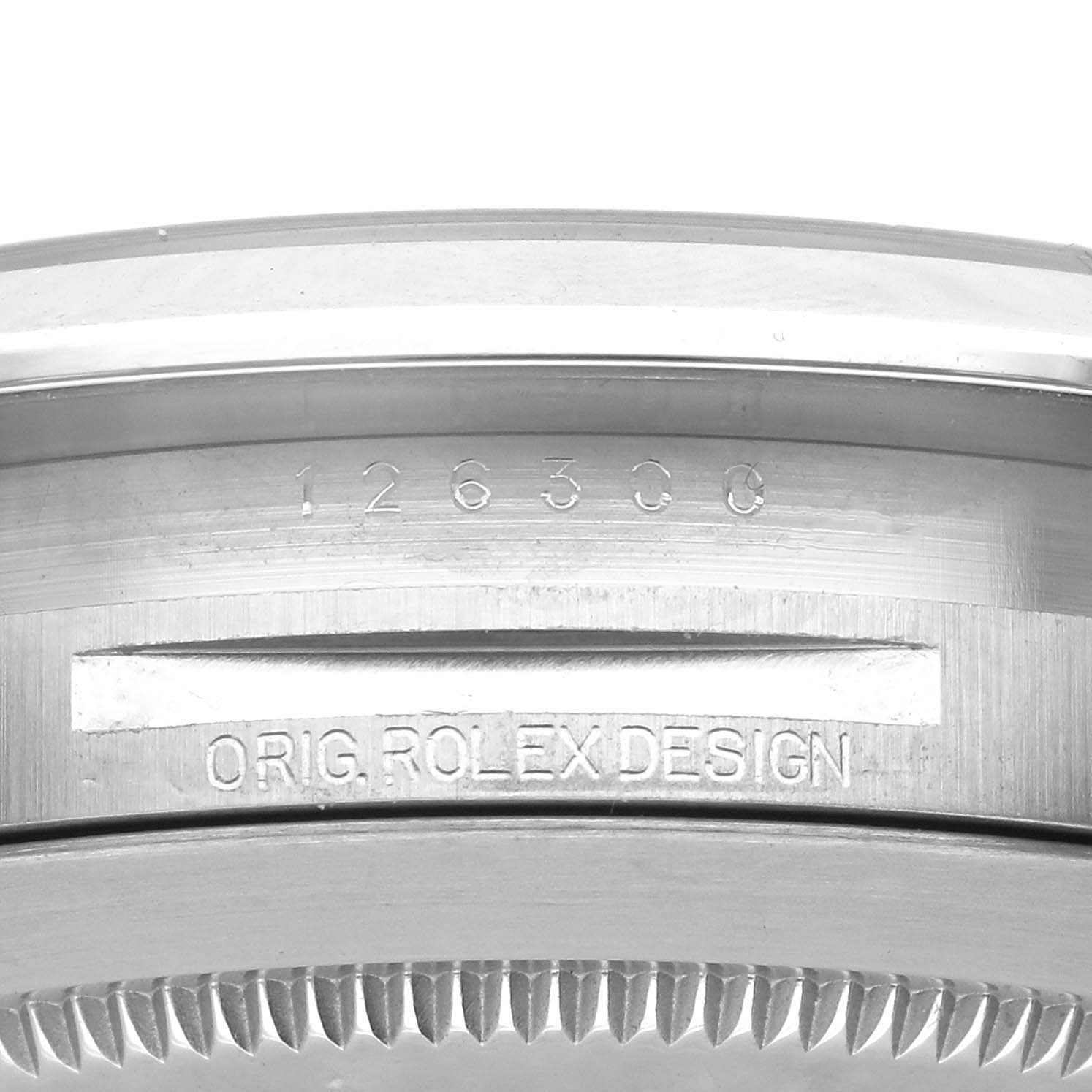 This image shows a close-up angle of the case side of a Rolex Datejust 41 126300 Men's Stainless Steel Grey Dial 126300 Men's Stainless Steel Grey Dial, featuring the model number 126300 and "ORIG. ROLEX DESIGN" engraving.
