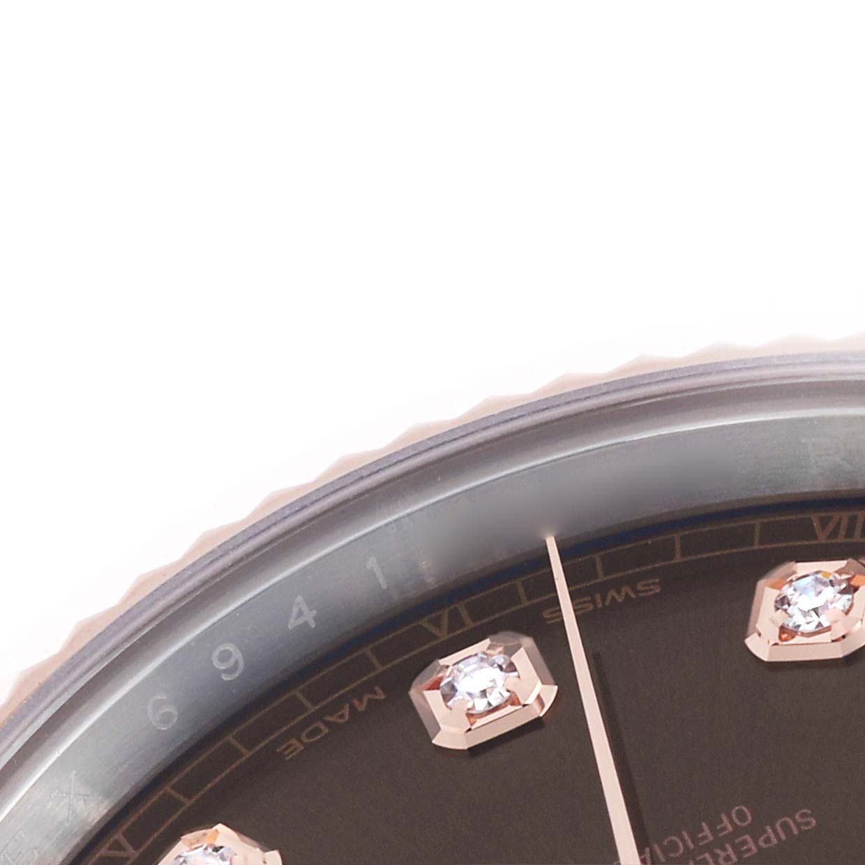The image shows a close-up of the Rolex Datejust 41 126331 Men
s Steel and Gold (two tone) Brown Dial, focusing on part of the bezel, dial, and diamond hour markers.