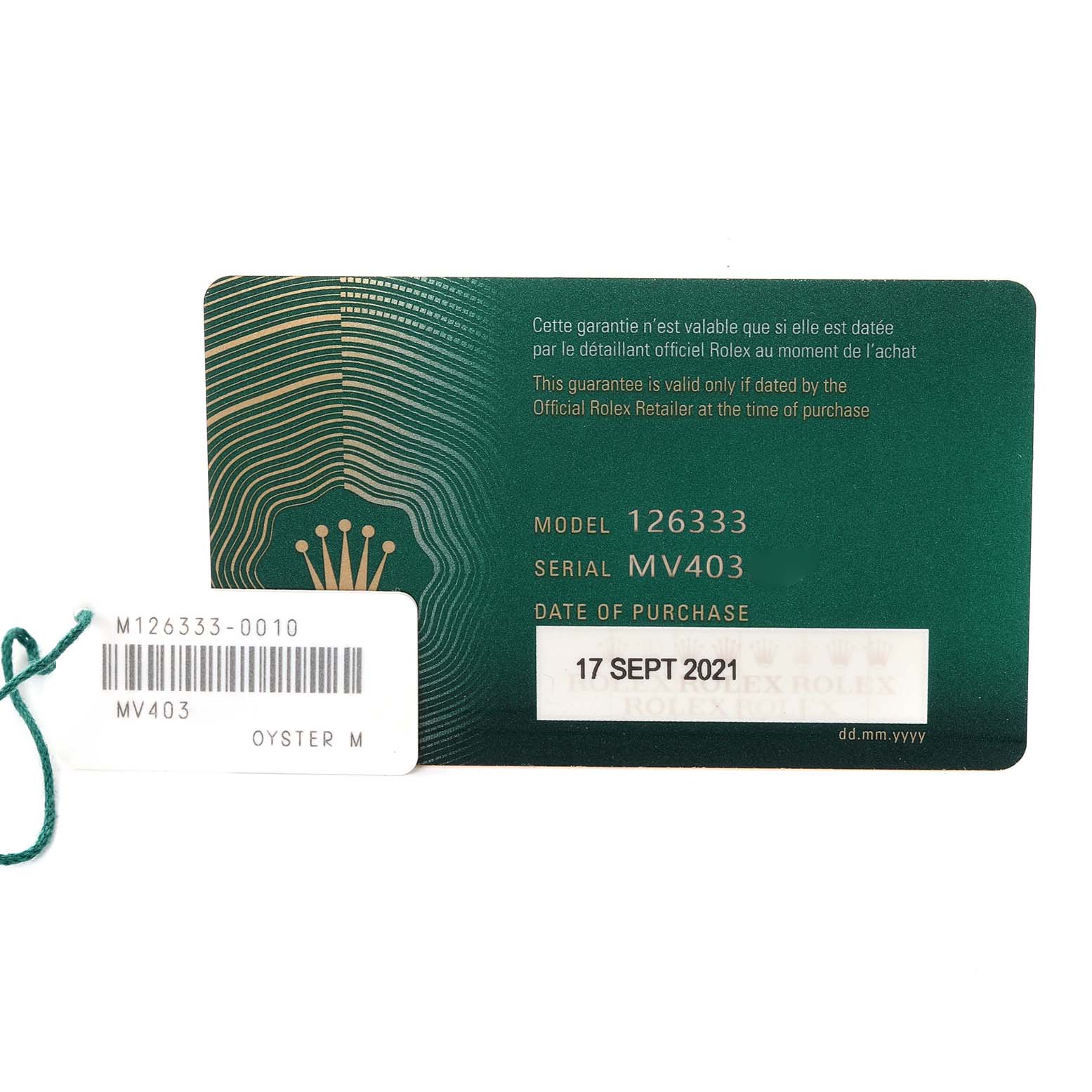 This image shows the warranty card and tag of a Rolex Datejust 41 126333 Men's Steel and Gold (two tone) Champagne Dial 126333 Men's Steel and Gold (two tone) Champagne Dial model, including model and serial numbers, with a purchase date.