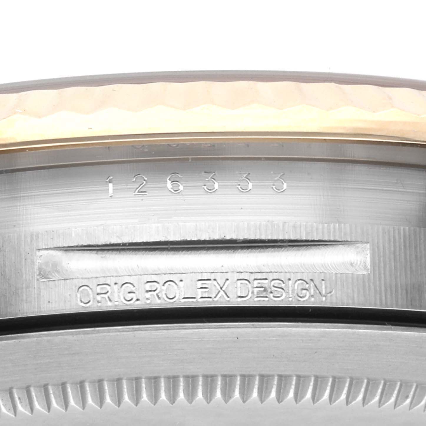 This close-up image shows the bezel and engraved model details of a Rolex Datejust 41 126333 Men's Steel and Gold (two tone) Champagne Dial 126333 Men's Steel and Gold (two tone) Champagne Dial watch.