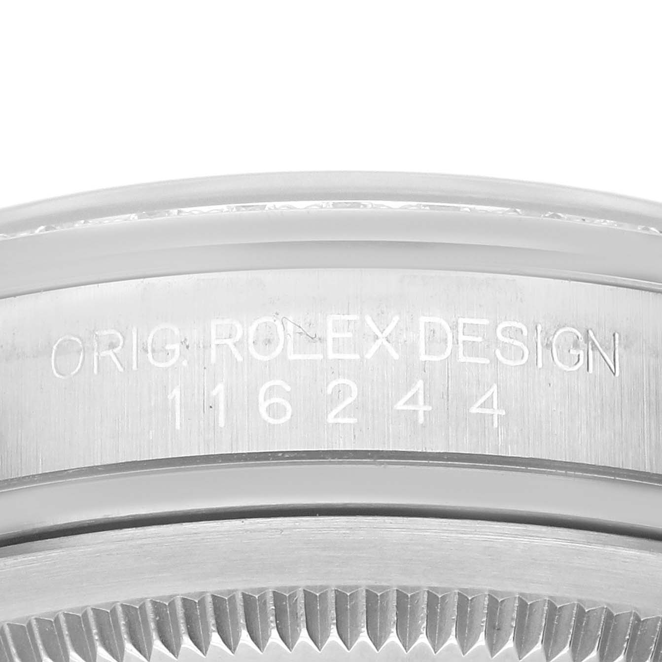 The image shows a close-up of the bezel and case of a Rolex Datejust 116244 Men
s Stainless Steel Black Dial 116244 Men
s Stainless Steel Black Dial, revealing the model number and "Orig. Rolex Design" engraving.