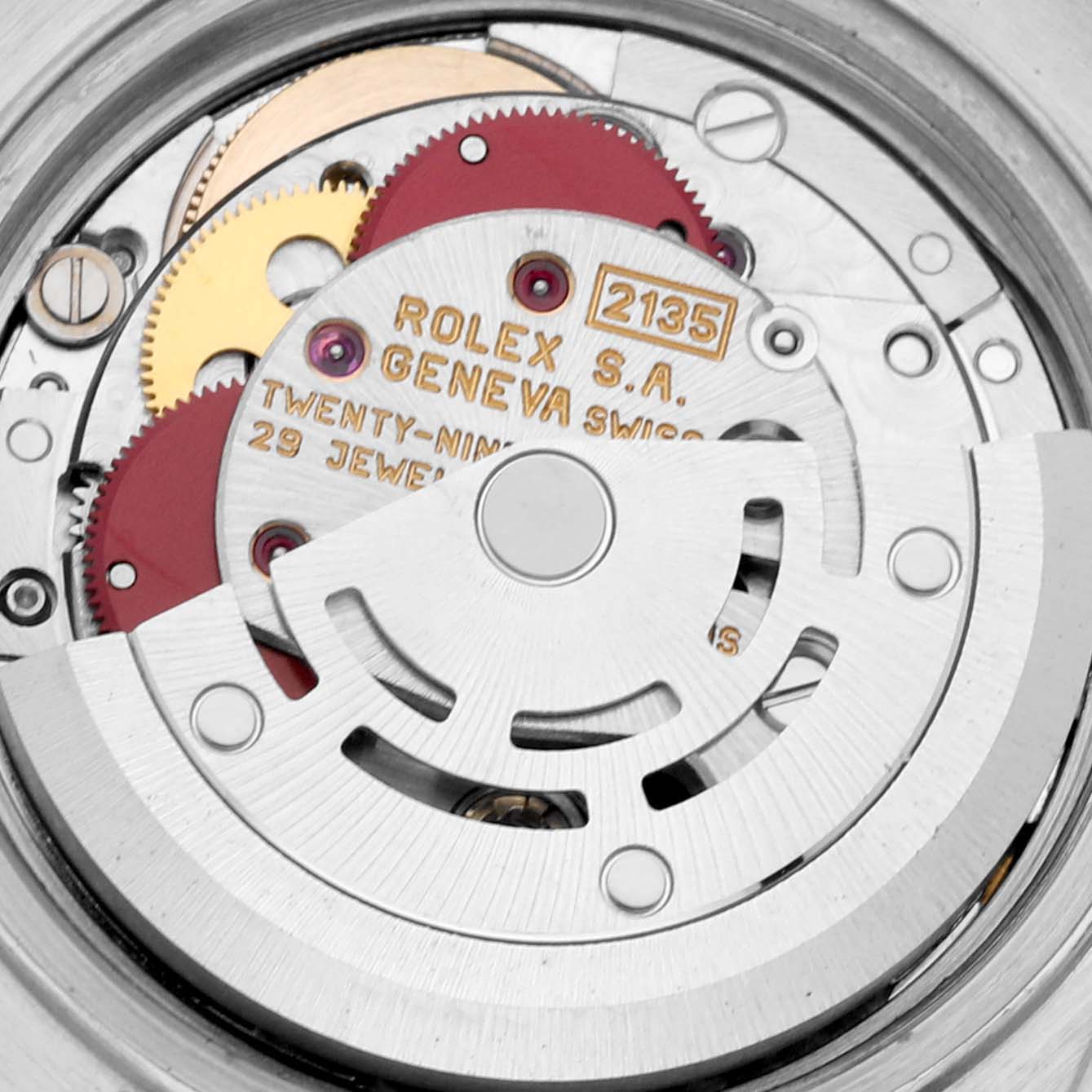 The image shows a close-up of the internal mechanism of the Rolex Datejust 69173 Women's Steel and Gold (two tone) Blue Dial 69173 Women's Steel and Gold (two tone) Blue Dial watch, highlighting its gears and movement components.