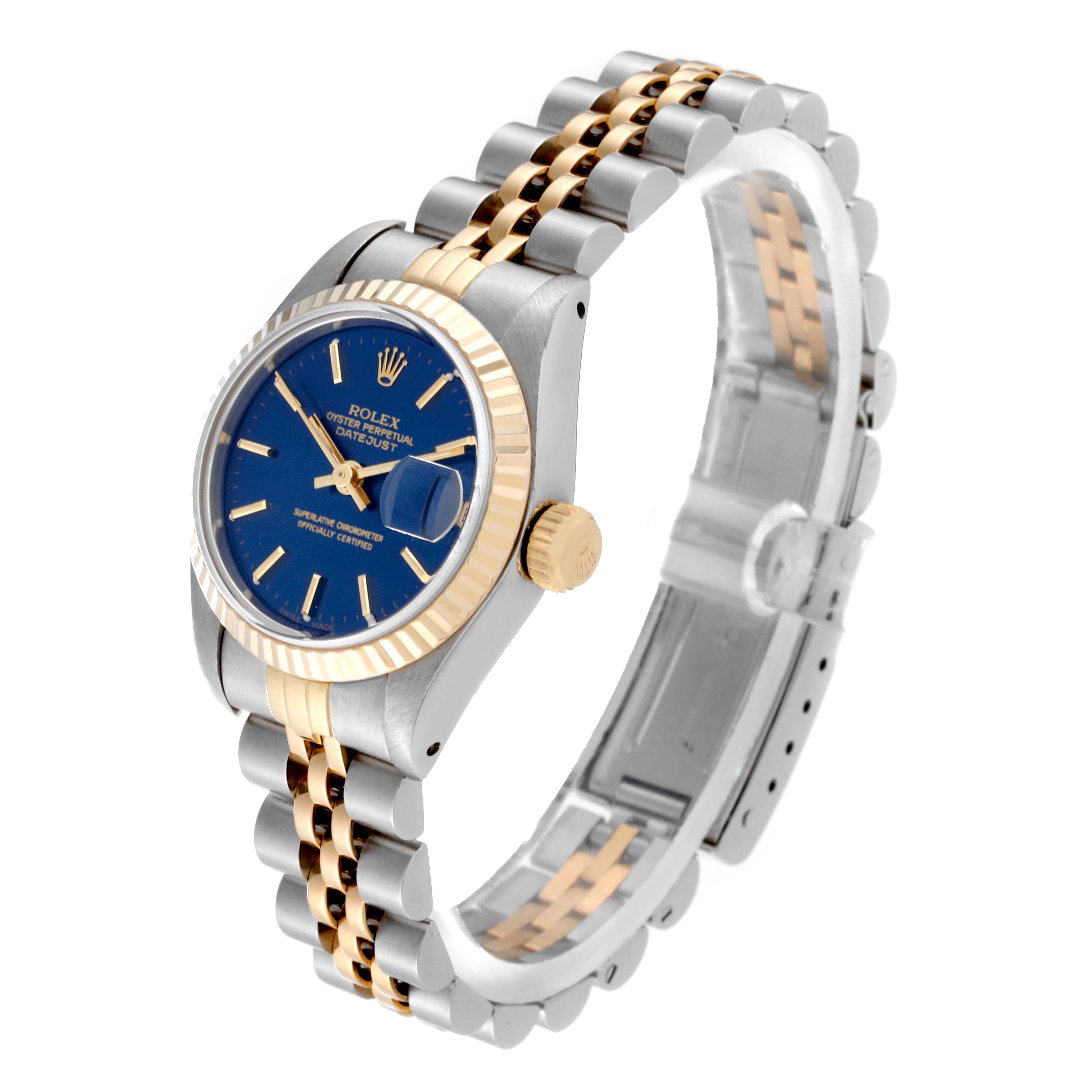 The Rolex Datejust 69173 Women's Steel and Gold (two tone) Blue Dial 69173 Women's Steel and Gold (two tone) Blue Dial watch is shown at an angled side view, displaying its blue dial, fluted bezel, crown, and two-tone jubilee bracelet.