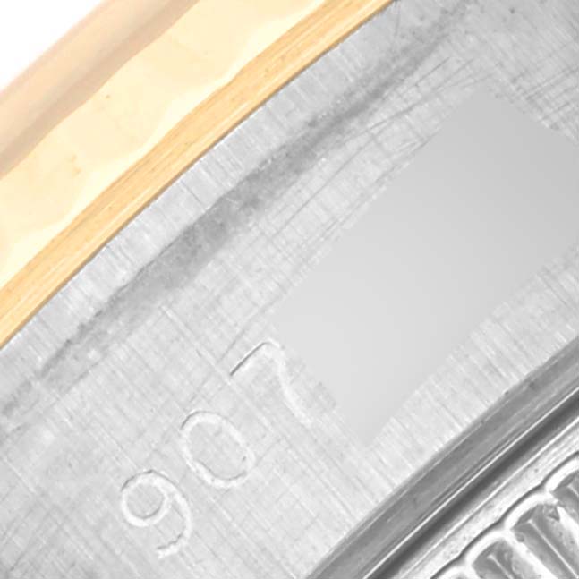 The image shows a close-up of the engraved serial number and part of the bezel of a Rolex Datejust 69173 Women's Steel and Gold (two tone) Blue Dial 69173 Women's Steel and Gold (two tone) Blue Dial watch.