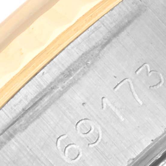 This close-up image shows the model number engraved on the side of the Rolex Datejust 69173 Women's Steel and Gold (two tone) Blue Dial 69173 Women's Steel and Gold (two tone) Blue Dial watch case.