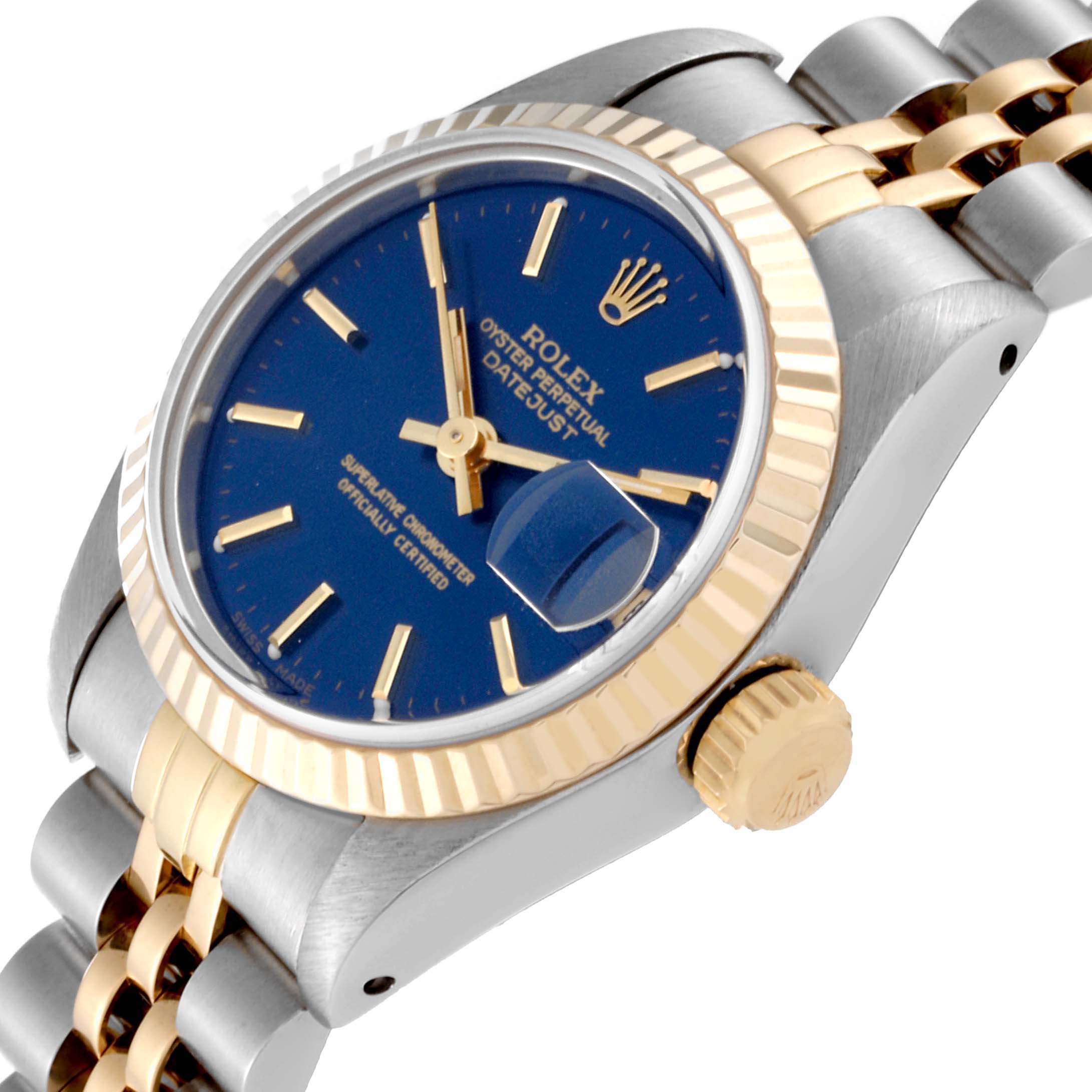This image shows a side view of a Rolex Datejust 69173 Women's Steel and Gold (two tone) Blue Dial 69173 Women's Steel and Gold (two tone) Blue Dial watch, highlighting its blue dial, gold fluted bezel, and two-tone bracelet.