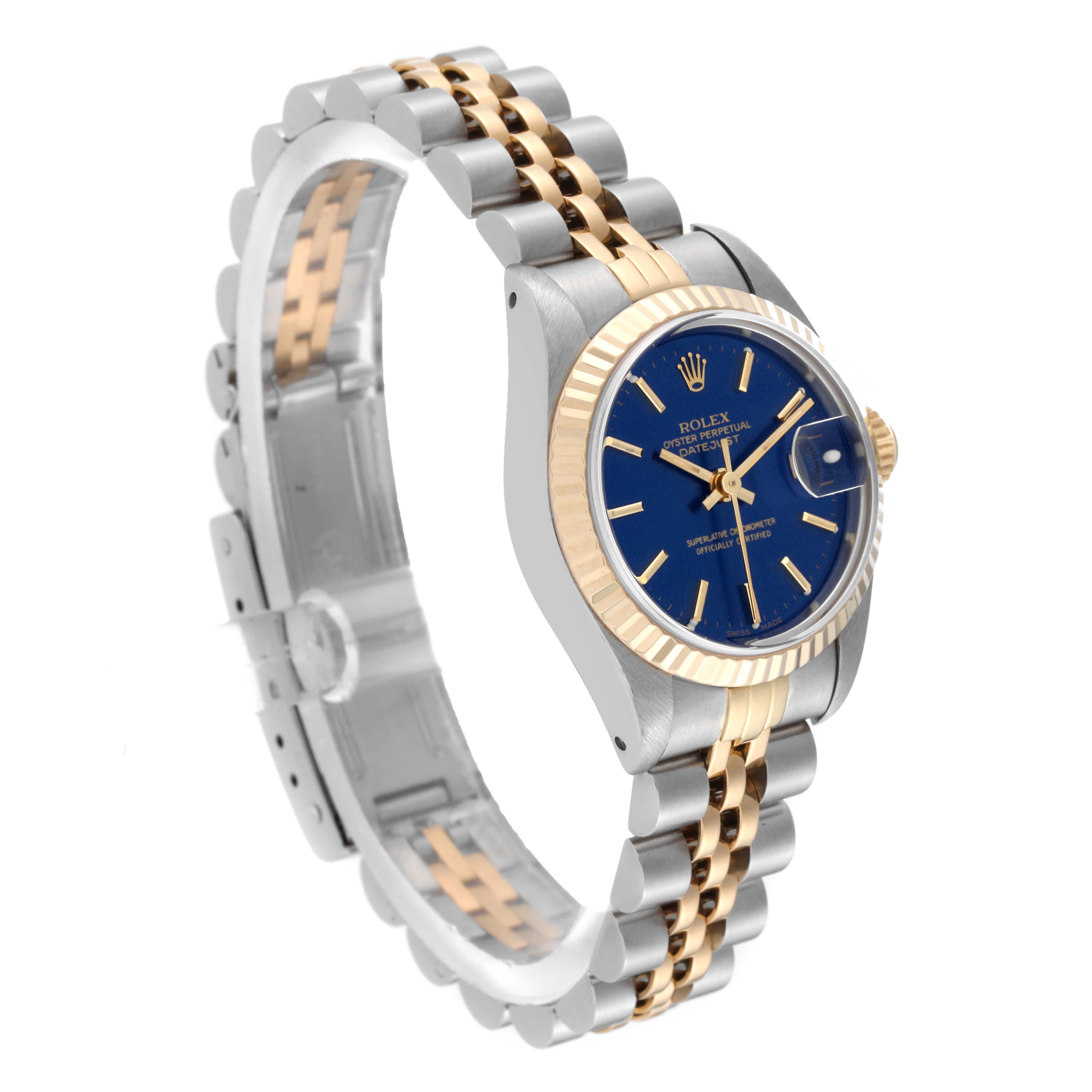 The image shows a Rolex Datejust 69173 Women's Steel and Gold (two tone) Blue Dial 69173 Women's Steel and Gold (two tone) Blue Dial watch at an angled view, displaying its stainless steel and gold bracelet, blue dial, and fluted bezel.