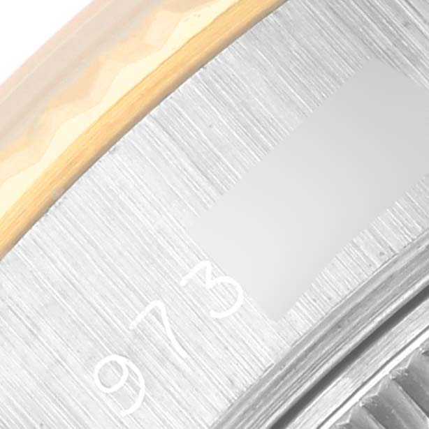 This image shows a close-up of the bezel and edge of the case back of a Rolex Datejust 69173 Women's Steel and Gold (two tone) Champagne Dial 69173 Women's Steel and Gold (two tone) Champagne Dial watch.