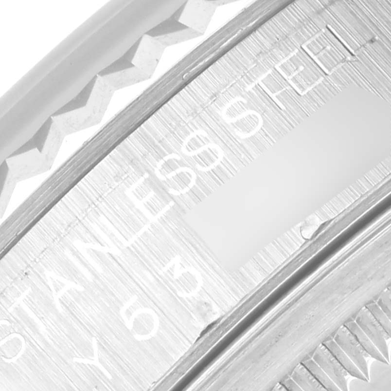 This is a close-up view of the inner bezel and rehaut of the Rolex Datejust 16234 Men
s Stainless Steel White Dial 16234 Men
s Stainless Steel White Dial, showing the engraving "STAINLESS STEEL."