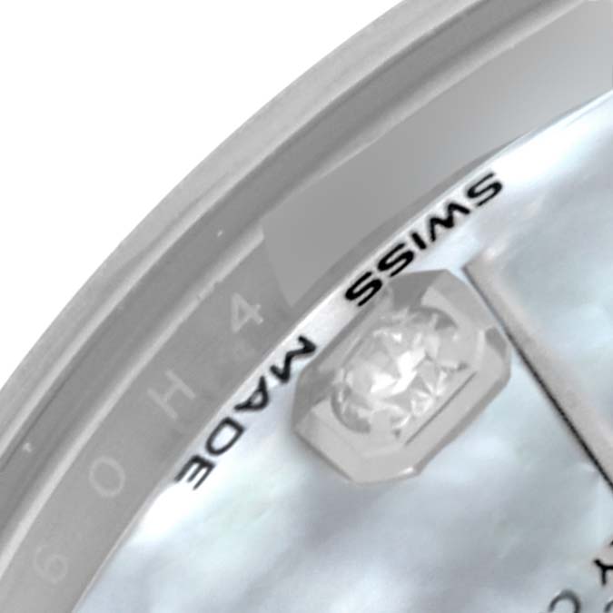 This close-up image of a Rolex Mid-Size 178274 Women's Stainless Steel Mother of Pearl Dial 178274 Women's Stainless Steel Mother of Pearl Dial watch shows part of the dial, including the "Swiss Made" text and a diamond marker.
