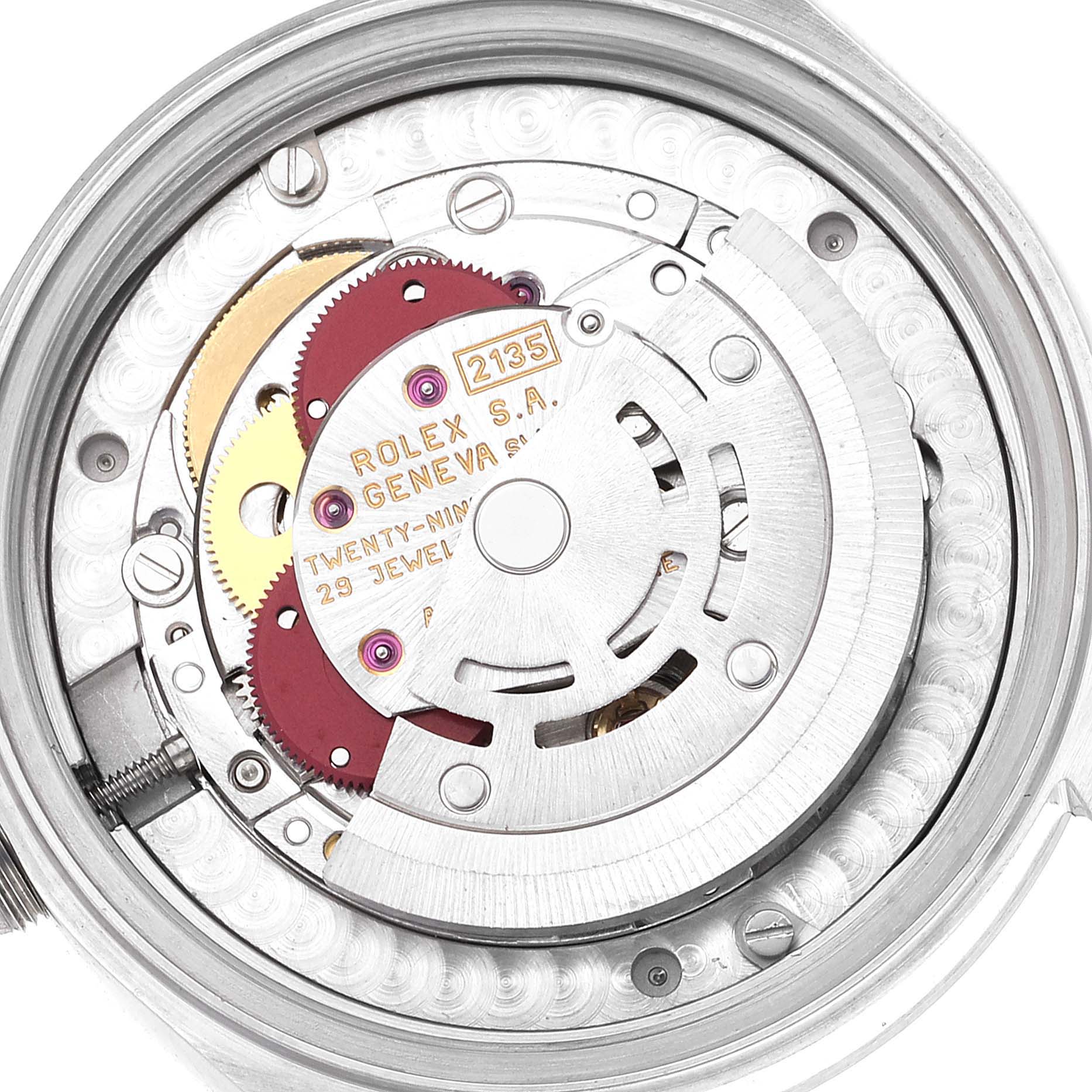 The image shows a close-up view of the movement mechanism inside a Mid-Size Rolex watch, displaying gears and the rotor.