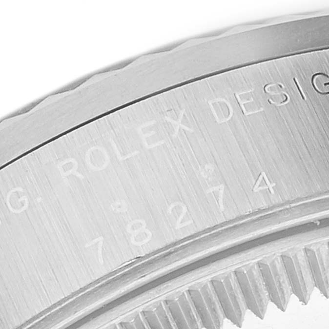 The image shows a close-up of the case back engraving on a Rolex Mid-Size 78274 Women's Stainless Steel Blue Dial 78274 Women's Stainless Steel Blue Dial watch, highlighting the brand and design model number.