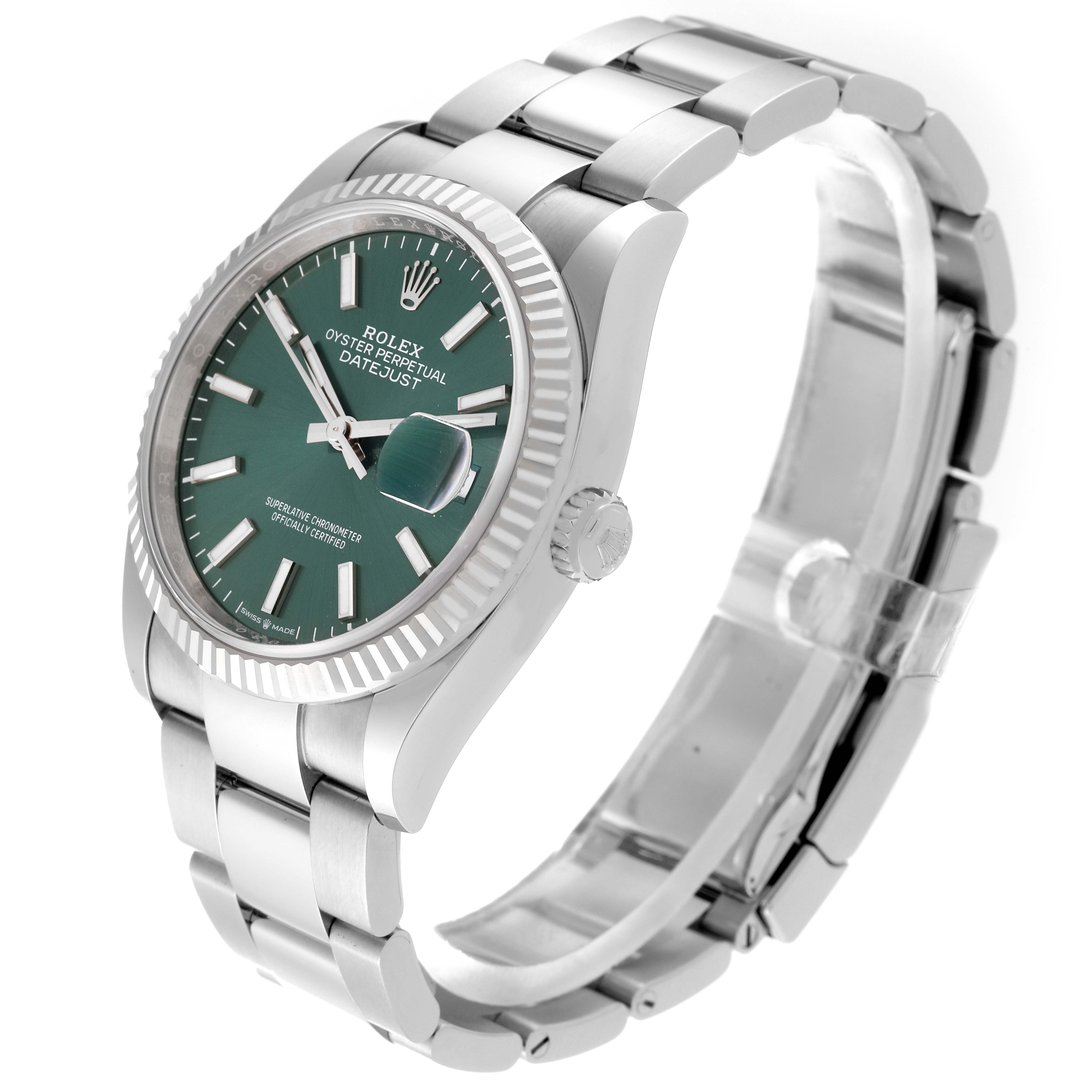 The Rolex Datejust 126234 Men's Stainless Steel Green Dial 126234 Men's Stainless Steel Green Dial watch is shown at a slight angle, displaying its green dial, fluted bezel, and stainless steel bracelet.