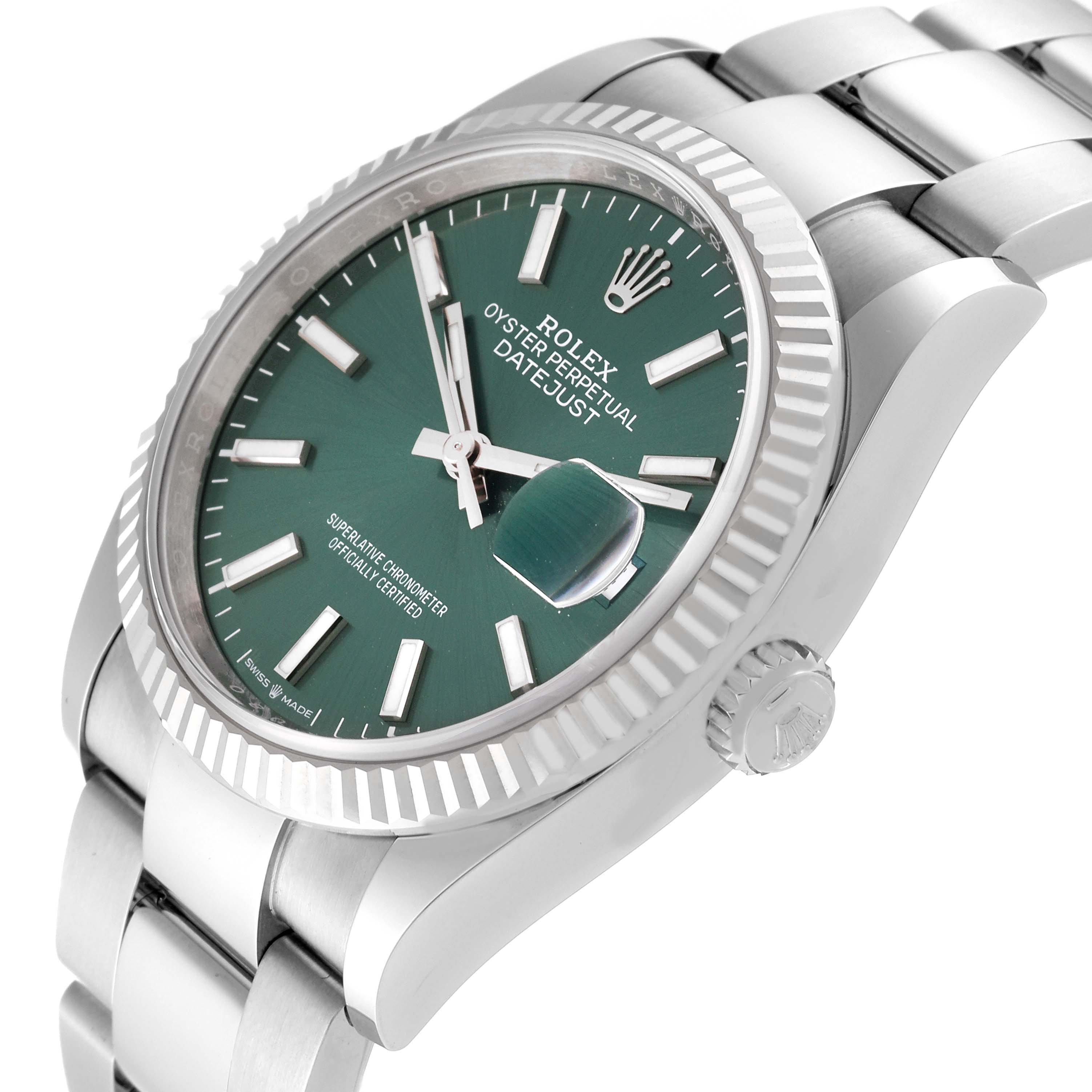 This image shows a Rolex Datejust 126234 Men's Stainless Steel Green Dial 126234 Men's Stainless Steel Green Dial watch at a three-quarter angle, highlighting the green dial, fluted bezel, and part of the bracelet.