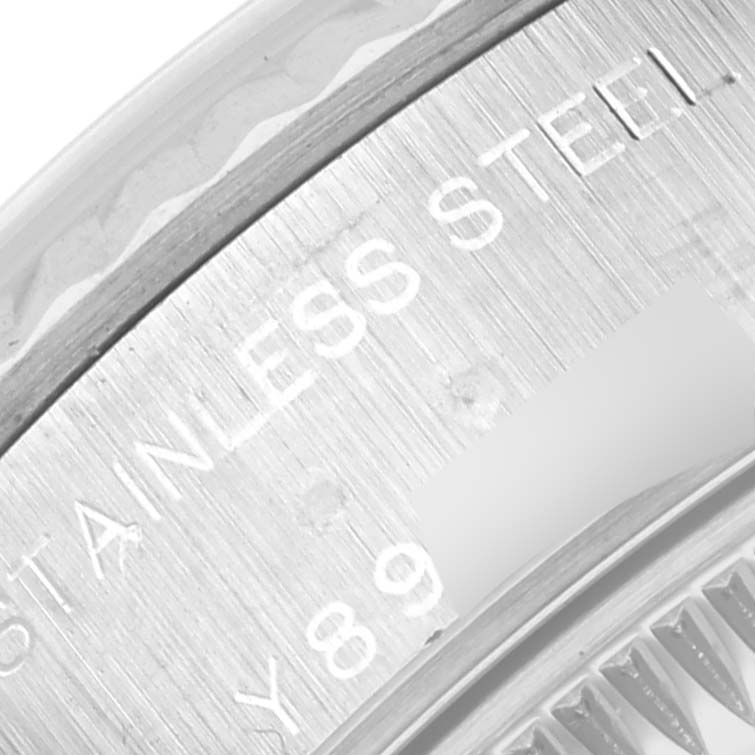 This image shows a close-up, angled view of the stainless steel case back of a Rolex Datejust 79174 Women
s Stainless Steel Mother of Pearl Dial 79174 Women
s Stainless Steel Mother of Pearl Dial watch.