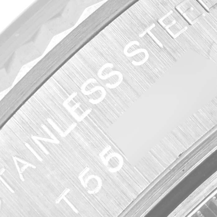 The image shows a close-up view of the Rolex Datejust 69174 Women's Stainless Steel Pink Dial 69174 Women's Stainless Steel Pink Dial's inner case back, specifically displaying the "STAINLESS STEEL" lettering.