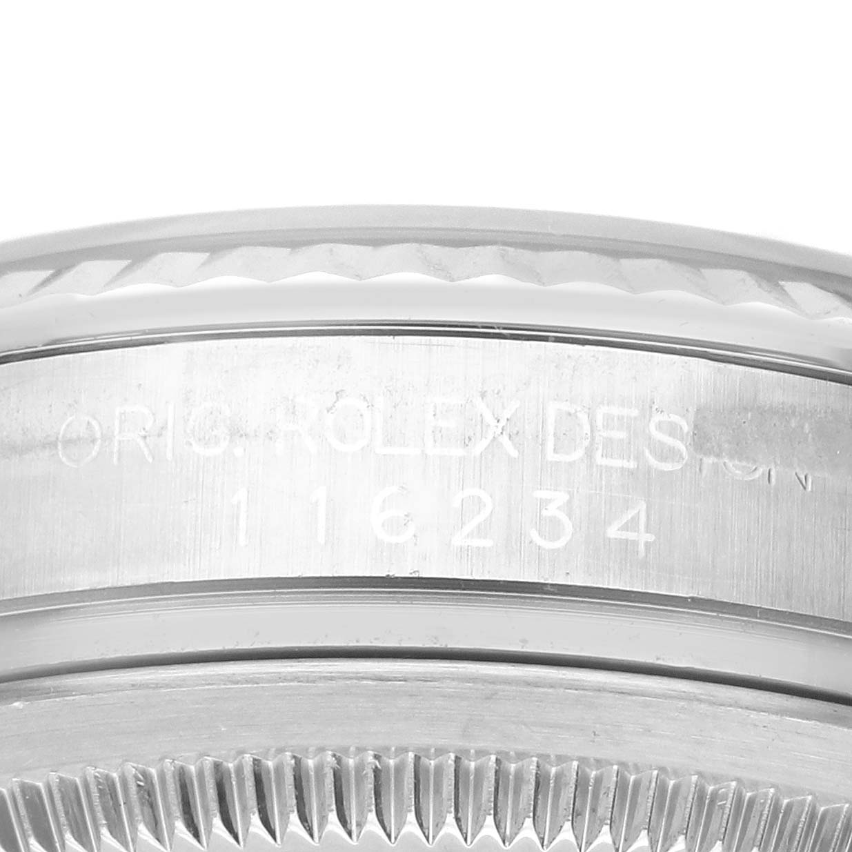 The image shows a close-up of the engraved bezel and case of a Rolex Datejust 116234 Men
s Stainless Steel Silver Dial 116234 Men
s Stainless Steel Silver Dial watch.