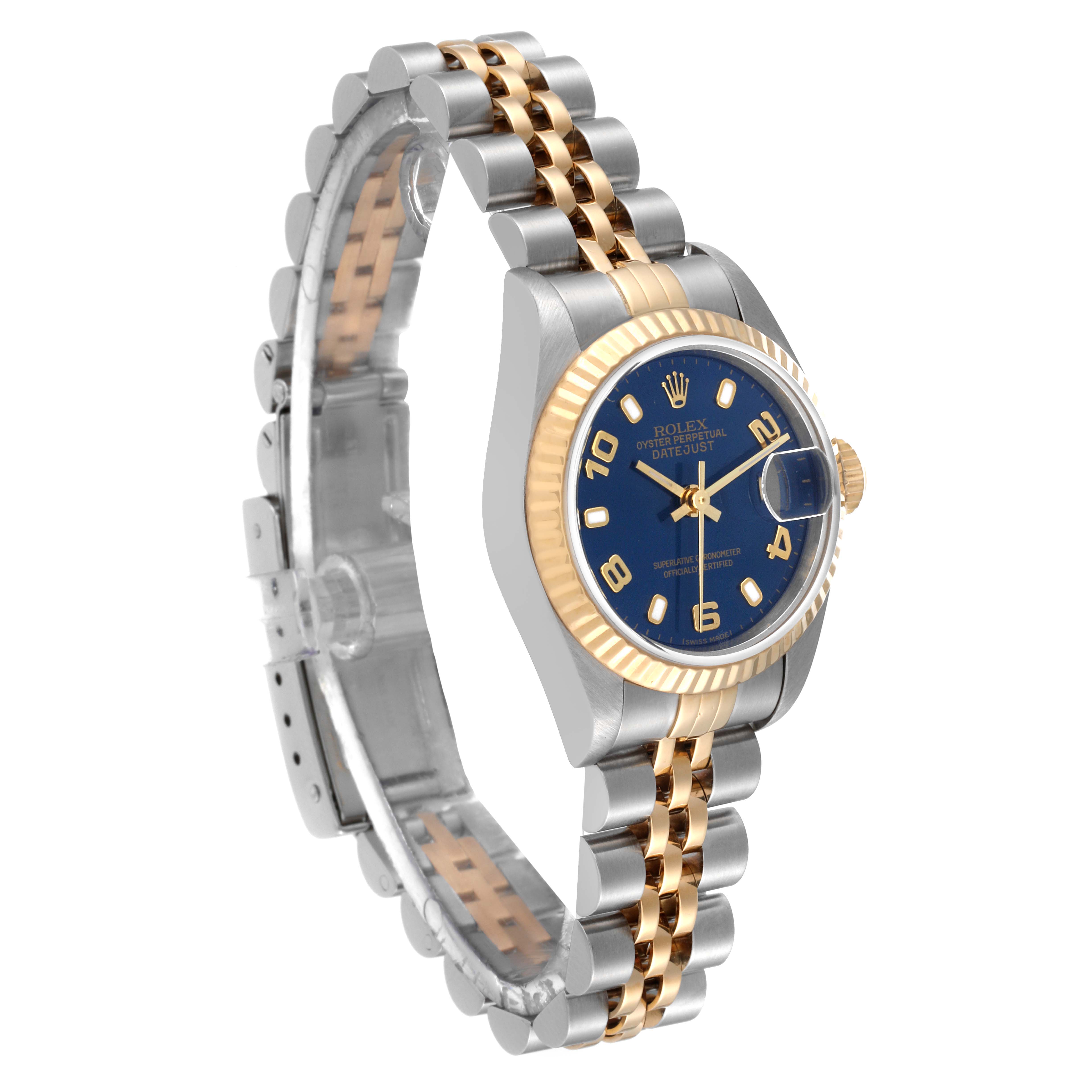 This image shows a side angle view of a Rolex Datejust 79173 Women's Steel and Gold (two tone) Blue Dial 79173 Women's Steel and Gold (two tone) Blue Dial watch, highlighting the blue dial, fluted bezel, and two-tone bracelet.