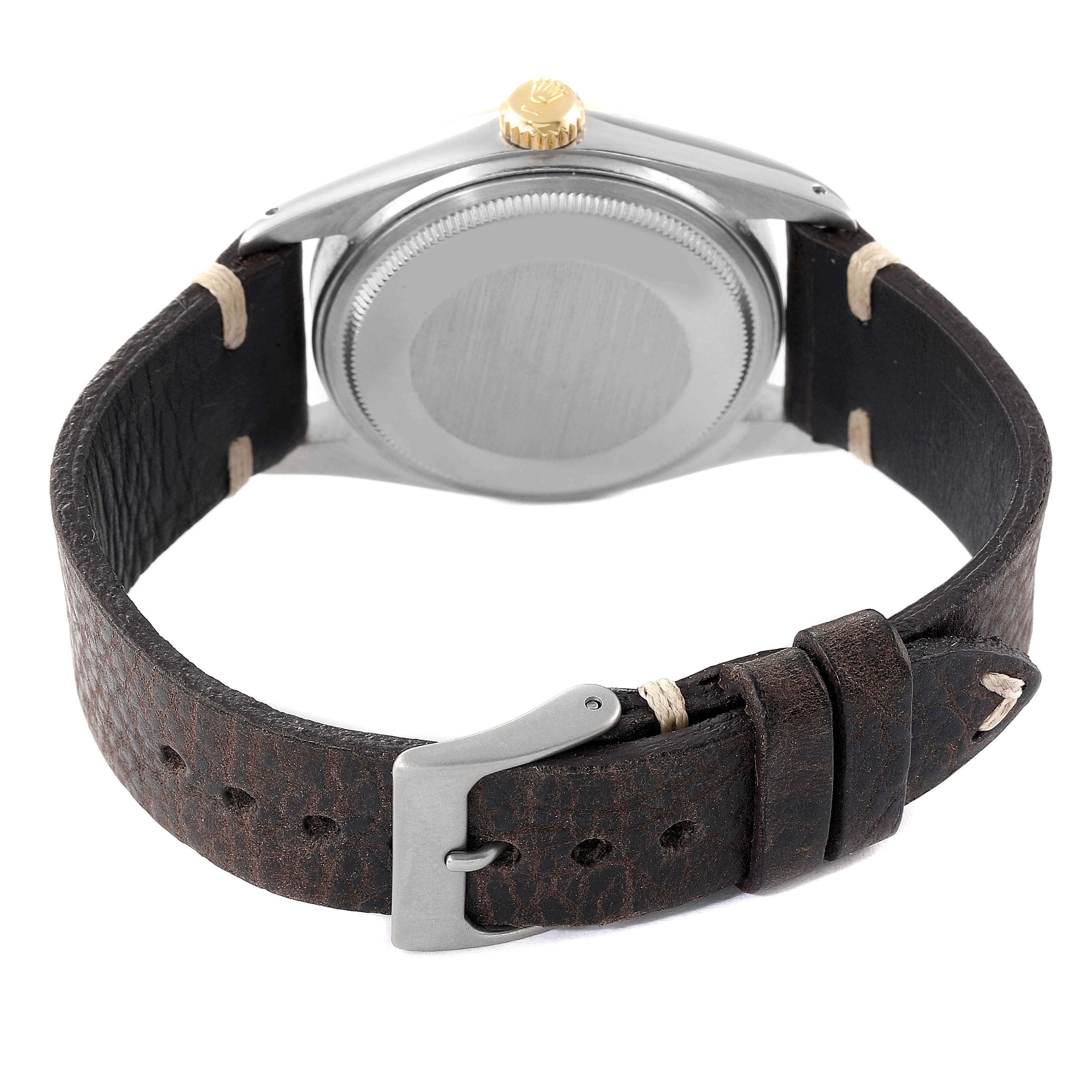 This image shows the back view of the Rolex Vintage Collection 16013 Men's Stainless Steel White Dial 16013 Men's Stainless Steel White Dial watch, displaying its leather strap, buckle, and case back.