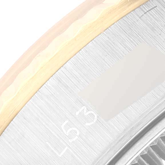 The image shows a close-up side view of the steel and yellow gold bezel of the Rolex Datejust 69173 Women's Steel and Gold (two tone) Champagne Dial 69173 Women's Steel and Gold (two tone) Champagne Dial watch.