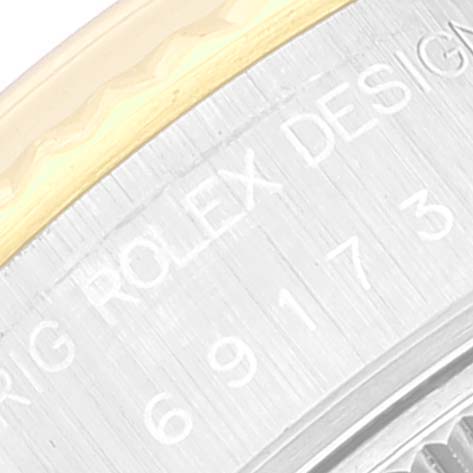 This close-up image shows the etched bezel of a Rolex Datejust 69173 Women's Steel and Gold (two tone) Champagne Dial 69173 Women's Steel and Gold (two tone) Champagne Dial watch, highlighting the brand engraving.
