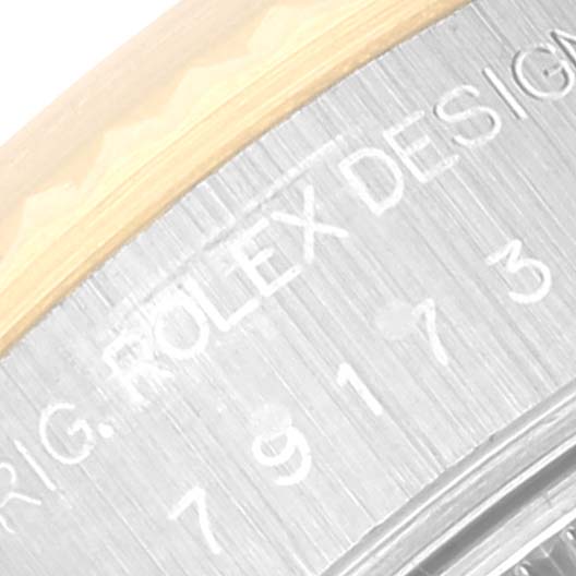 The close-up image shows the engraved bezel of the Rolex Datejust 79173 Women's Steel and Gold (two tone) Champagne Dial 79173 Women's Steel and Gold (two tone) Champagne Dial watch.