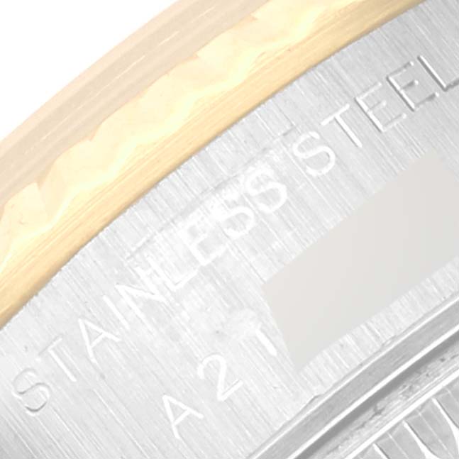 The image shows a close-up of the edge of the case back and part of the bezel of a Rolex Datejust 79173 Women's Steel and Gold (two tone) Champagne Dial 79173 Women's Steel and Gold (two tone) Champagne Dial watch.